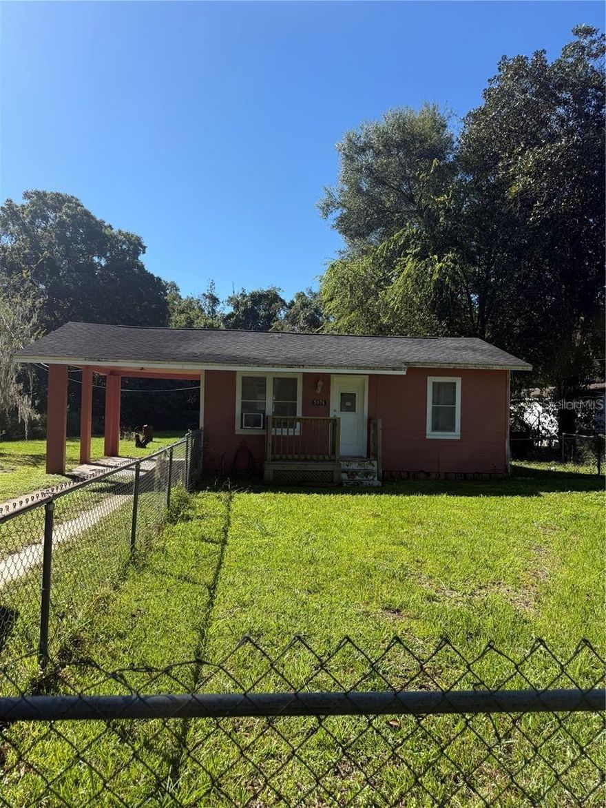 This cozy 1/1 home offers comfortable living with tile floors throughout and a functional layout. Enjoy peace of mind with a fully fenced yard—
perfect for pets, gardening, or outdoor entertaining. Situated on a generous .32-acre lot, there’s plenty of space to expand or relax. Includes a
covered carport for convenient parking. Located close to schools and shopping, this home combines comfort and convenience in a great location!