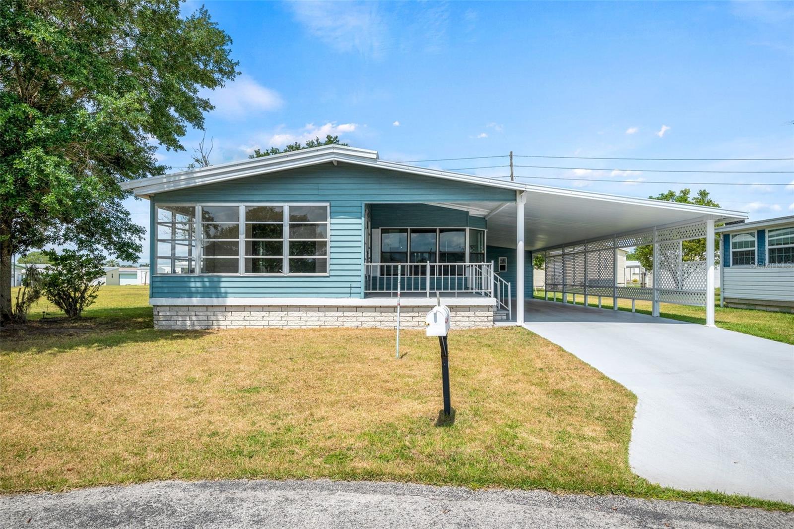 This 2 bedroom 2 bath home is located on a tranquil cul de sac within the desirable Betmar Acres 55+ community. The front of the home features an air-conditioned lovely Florida room where you can enjoy your morning coffee, sit and read a book, entertain friends or utilize the covered front porch.
Inside, the home features an open concept living area that is perfect for entertaining guests or enjoying quality time with loved ones. Th living room is flooded with natural light and flows seamlessly into the dining area and kitchen. The kitchen is equipped with stainless steel appliances, ample cabinetry, and lots of windows.
The primary bedroom is generously sized with a large closet and an ensuite bathroom that includes a walk-in shower. The second bedroom is also sizable and is located across from the second bathroom which features a tub-shower combo.
Other features of this lovely home include a laundry room, a 3 vehicle carport, and a shed. There are adjustable sun shades over the windows so you can control the amount of sunlight.
The 55+ community provides various amenities, such as 27 holes of golf, 3 club houses, 2 pools and hot tubs, several walking paths around the ponds, and many clubs, creating a vibrant and social environment for residents. This home is ideal for those seeking a peaceful, low-maintenance lifestyle in a friendly community. NON PET section. Don't forget it’s near the the golf and pools along with 3 clubhouses a library, walking paths, Game rooms (Billiards, Table Tennis, Board Games) miniature golf, enclosed shuffleboard Courts, Tennis courts, pickle ball courts, basketball court, Bocce courts and Bingo and dog park. Come check out this home today!