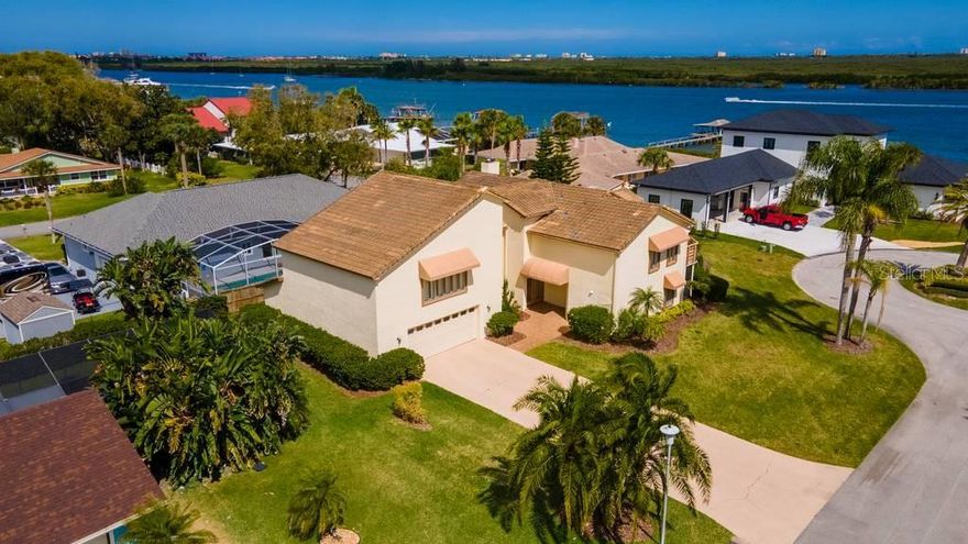 Spacious home with Intracoastal dock on quiet cul-de-sac just off Riverside Drive. Featuring 4 bedrooms, 4.5 baths, family room, bonus room and 2 car garage, this large two-story home is close to the Yacht Club & about a mile to downtown Canal Street shops & restaurants. Livingroom with fireplace. Kitchen with stainless & granite.  Breakfast nook & family room overlook large east-facing patio. Large dining room.  Master suite with fireplace, whirlpool, bidet & large private deck.  The downstairs guest suite is ideal second master suite & has private screened porch.  There is an additional guest suite upstairs as well.  Three of the four HVAC units are 2018.  Well & sprinkler system for yard care, & additional well for the water to air 2019 HVAC.  The space above the 800 square foot garage is currently use as an office, dark room & laundry & could be easily transformed into in-law quarters or more bedrooms.  Updating is needed, but so much potential!  Enjoy river breezes & some river views from this custom-built home with over 4600 square feet living area, providing plenty of room for large family, home office & the opportunity to keep your boat in your own slip (#3), too. ;Water: City