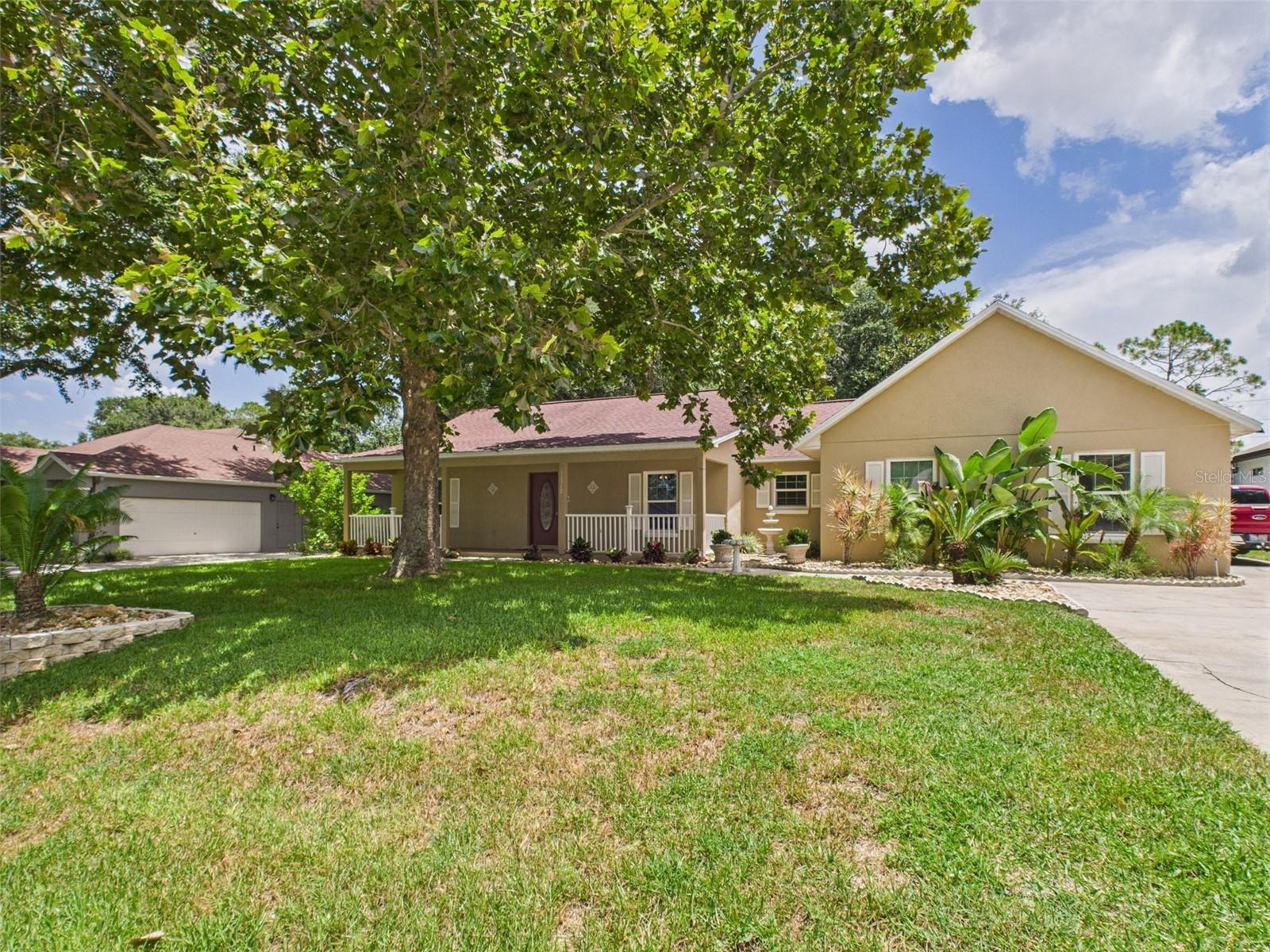 POOL HOME! Discover the perfect blend of charm, privacy, and updates with this beautifully maintained 3-bedroom, 2-bath pool home in the heart of Clermont. Nestled in a picturesque neighborhood where majestic oak trees create a canopy of shade and character, this residence offers the ideal Florida lifestyle. Step inside to find a spacious single-story split floor plan with a large living area flowing into an updated kitchen featuring granite countertops, a stone backsplash, pantry with shelving for easy organization, and newer stainless steel appliances. Enjoy casual meals at the eat-in counter or in the cozy dining nook. Bright white freshly painted walls and brand-new carpet flooring create a welcoming, move-in-ready atmosphere. Your private outdoor oasis boasts a screen-enclosed (2011) saltwater pool with cool deck (2011) and a hot tub/spa (2011), powered by 8 solar pool panels (2011) for energy-efficient relaxation. The roof was redone in 2016, and all windows were replaced in 2017, providing both comfort and peace of mind. Additional highlights include an attached 2-car side-facing garage with a spacious driveway, ideal for parking, workshop, and storage needs. The community provides private boat ramp access to the Clermont Chain of Lakes—17 interconnected lakes with over 8,600 acres of water for boating and fishing. Whether you're looking for a personal residence or a savvy investment, this move-in-ready gem delivers comfort, space, and freedom. Seller financing and private financing available. 0% DOWN PAYMENT FINANCING OPTION AVAILABLE. Do NOT wait, it will NOT last long!