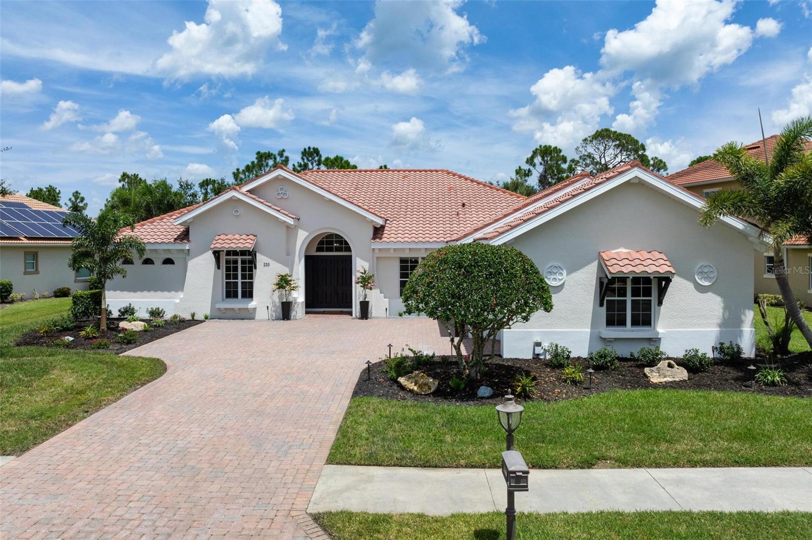 Rare Preserve-View Estate in Venetian Golf & River Club — Where Elegance Meets Resort Living
Opportunities to own in this exclusive enclave are few and far between—making this residence an extraordinary offering. Located in one of the most private sections of the Venetian Golf & River Club, this luxurious single-story Grand Estate home combines timeless design, modern comfort, and peaceful preserve views to create a true sanctuary.
This expansive residence features 3 generously sized bedrooms, 3 full bathrooms, a dedicated home office, and a flexible bonus room that can easily function as a den, home gym, or be converted into a fourth bedroom to suit your lifestyle.
Upon entry, a grand foyer welcomes you into a light-filled great room with soaring ceilings, crown molding, and expansive pocketing sliding glass doors that seamlessly connect indoor and outdoor living. The screened lanai showcases serene preserve views, providing complete privacy and breathtaking views.
The gourmet kitchen is ideal for both everyday living and entertaining—offering granite countertops, stainless steel appliances, a large pantry closet, custom cabinetry with abundant storage, and two distinct dining areas: a formal dining room and a cozy breakfast nook overlooking the lanai, perfect for morning coffee.
The oversized primary suite is a true retreat, featuring a spacious sitting area, two walk-in closets, and private french door access to the lanai. The en-suite bath exudes spa-like luxury with dual vanities, a soaking tub, and a large walk-in shower.
Two additional bedrooms are located on the opposite side of the home for enhanced privacy and have ample closet storage, and conveniently located bathrooms. While the third full bathroom—accessible directly from the lanai—also serves as a pool bath.
The outdoor living area is equally impressive. The screened lanai includes a heated saltwater pool and spa, complete with two waterfalls and surrounded by lush, updated landscaping and no rear neighbours. The outdoor kitchen features a brand new built-in gas grill, beverage refrigerator, and bar seating—perfect for alfresco dining and entertaining. Multiple lounging areas provide additional comfort and an oversized shade umbrella keeps the dining area cool.
This estate also boasts a spacious 3-car side-entry garage and has been thoughtfully updated with two new HVAC units, a newer hot water heater, fresh interior and exterior paint, and refreshed landscaping, ensuring a move-in-ready experience.
Located just a short stroll from the River Club, residents enjoy access to an array of amenities including a resort-style pool, lap pool, state-of-the-art fitness center, six Har-Tru tennis courts, pickleball, fine dining, walking and biking trails, and optional championship golf.
All of this is perfectly situated just minutes from I-75, the new Sarasota Memorial Hospital–Venice campus, and the beaches, boutiques, and restaurants of charming downtown Venice.
This is resort-style living at its most elegant, private, and convenient. Don’t miss your chance to make this exceptional estate your own.
