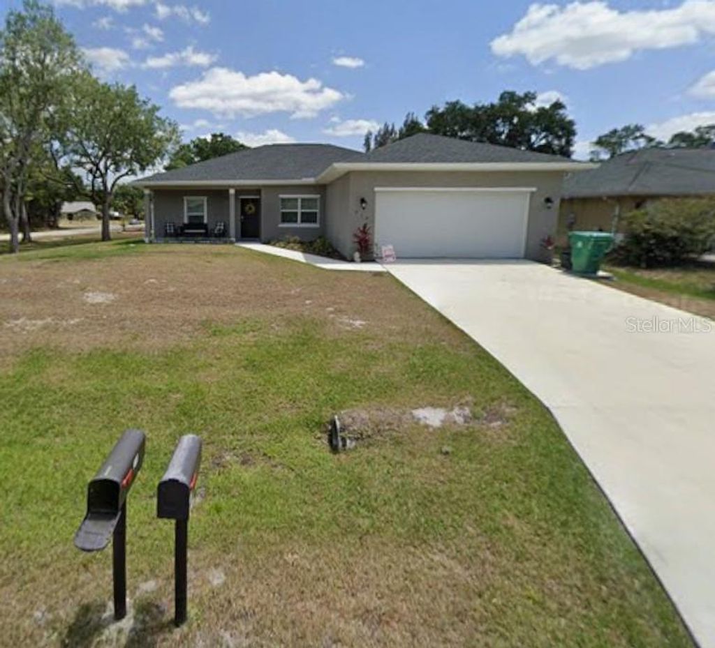 Photo of 719 Haleybury Street, Port Charlotte, FL 33948 (MLS # C7518725)