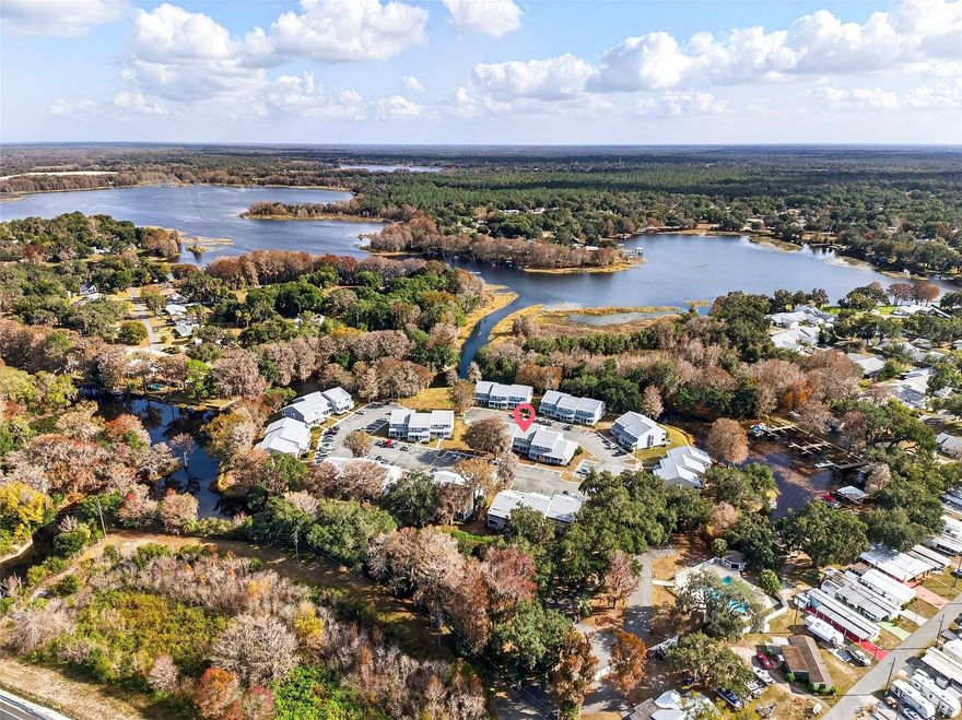 LAKE LIFE with your own private boat ramp with Maintenance free Living!...This 2 BD/2.5 BA multi-level townhome is perfectly placed amongst the Tsala Apopka Chain of Lakes, in the waterfront stay and play community of Cypress Cove. Upon arrival you can just sense that water is nearby with the Key West architectural style of the exterior, especially the spindle & corbel adorned front porch. 30 year architectural roof in 2023. The interior of the home features the common area downstairs with laminate flooring, a half bath, a living room/dining room combo & a slider that opens to the screen enclosed porch. The kitchen features a breakfast bar, granite countertop, tiled backsplash & a closet pantry. For dramatic effect, a spiral staircase takes you to 2 bedrooms, both have their own private bathrooms on the upper level. The primary bedroom features a slide that opens to a balcony for evening cocktails, a good read or just a quiet place to unwind & dream about which lake you are going to fish on next. Cypress Cove Community offers a pool, gazebo & a private boat ramp. The boat ramp is on a canal that provides direct access to Little Lake Spivey directly behind the community, Big Lake Spivey to the east & out to the rest of the chain of lakes. Conveniently, Big Lake Henderson is directly across Gulf to Lake Highway, where a public boat ramp is located as well. Jump on the Withlacoochee State Trail nearby for biking, skating or taking your dog for a quiet walk. . Only 1 mile to Downtown Inverness. Only 5 minutes to Liberty & Wallace Brooks Parks, shopping, restaurants & the Historic Valerie Theatre. If you love to fish this is the prime spot!FREE APPRAISAL - Credit at closing with preferred lender now until the 1st of April!