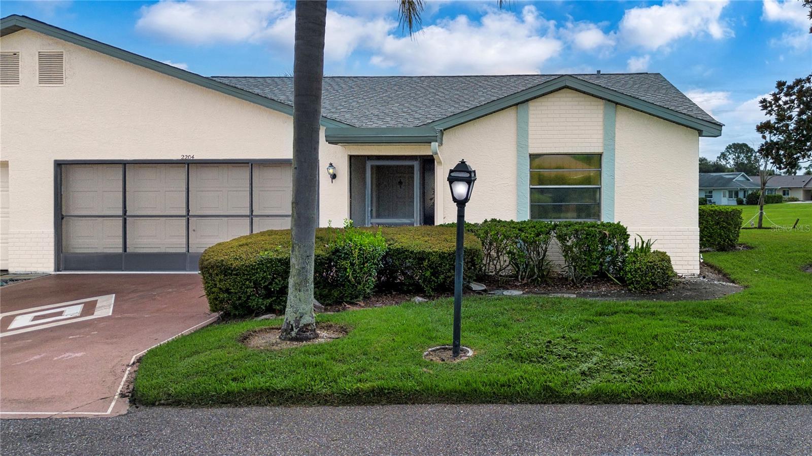 Outstanding opportunity! The least expensive condo with a garage in King’s Point AND the SELLER IS OFFERING A $5,000 FLOORING ALLOWANCE WITH AN ACCEPTABLE OFFER. This pretty Somerset model features a split floor plan, large living/dining room and a light, ample kitchen with eat-in area. The primary bedroom suite features a large walk-in closet, freshly painted bathroom with a pedestal sink and updated tile shower surround. Bedroom two offers privacy and an updated bathroom. An open patio overlooks a garden setting that is perfect for relaxing. Morning coffee will be a delight in your screened entryway. The 1 ½ car garage can accommodate a car and golf cart. This maintenance free condo features recent updates including: * A/C 2023 * Water Heater 2020 * Electric Panel 2020* Roof 2019 * CPVC supply pipes. Furniture, including a piano is available with the sale. Highgate IV HOA provides building insurance, roof replacement, exterior painting, lawn care, water, sewer, basic cable, internet, pest control, recreation amenities, tram transportation, road maintenance, 24-hour secured gate and professional management for a lower-than-most $690 per month. Residents enjoy a golf cart friendly environment with (2) clubhouses, (5) pools, (2) fitness centers, sport courts, clubs, activities, cafes, a sports bar and a spa too! Golf memberships are optional. Sun City Center has all the services you need: stores, medical facilities, financial services, and houses of worship. Minutes away is I75 with a short drive to Tampa, Sarasota and St. Petersburg, near 3 airports, beaches, theater, museums, fine dining, advanced medical, special events and major league sports too. What a great place to be living the dream!