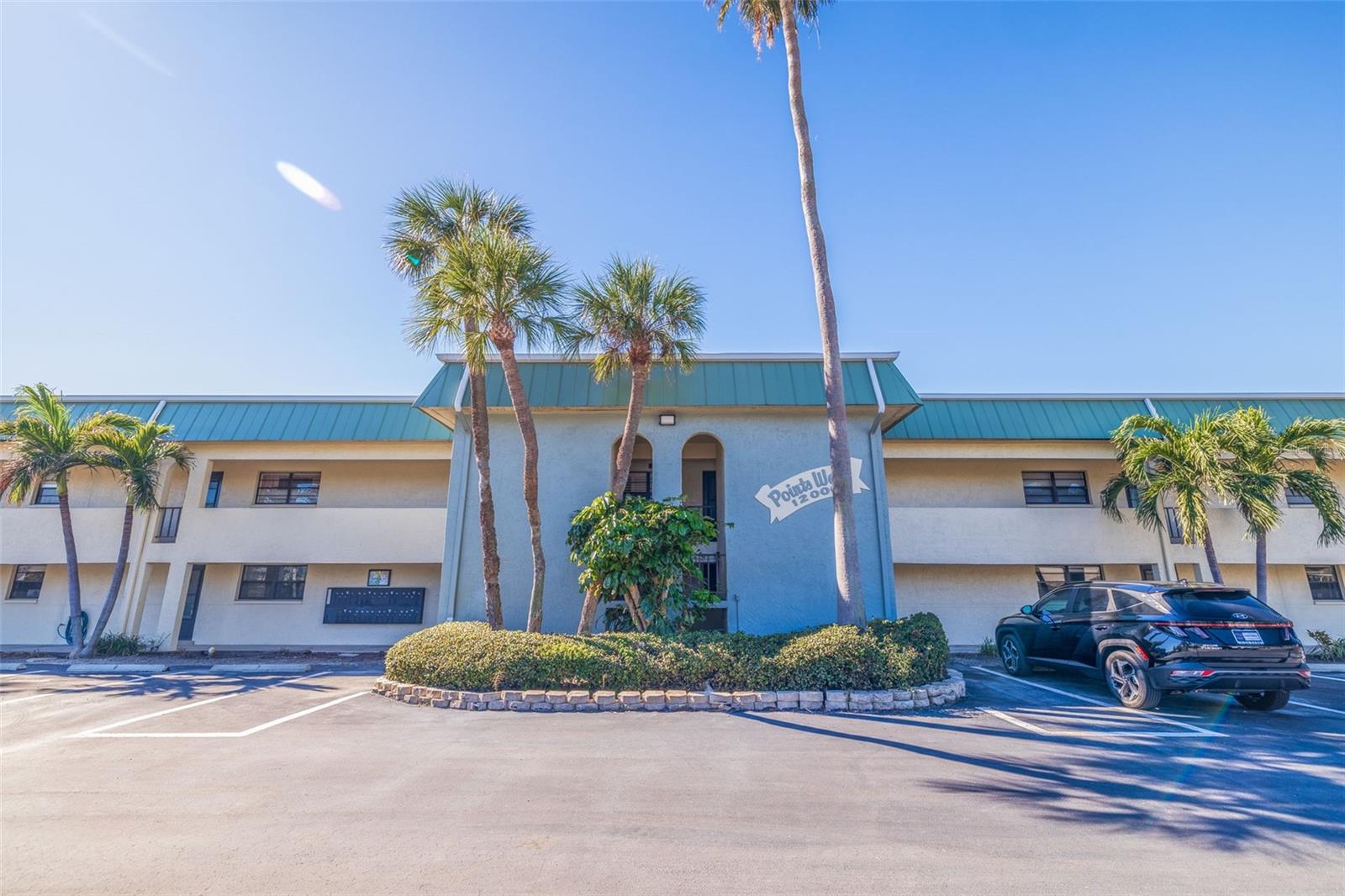 Coastal Elegance at Points West | 2 Bed, 2 Bath Waterfront Condo - Welcome to Points West Condominiums — a tranquil, waterfront community on the intracoastal in the heart of Treasure Island’s beloved Isle of Capri neighborhood. This nicely updated second-floor corner unit features 2 bedrooms, 2 bathrooms, and tasteful finishes throughout. You’ll love the upgrades: handsome new flooring in the spacious living area and sunlit porch, soft neutral paint tones, and high-quality, hurricane-rated windows that bring in natural light while keeping things quiet and secure. The living space flows seamlessly out to your private, enclosed patio — the perfect spot to unwind with sunset views over the water. Enjoy a lifestyle of coastal ease: you're just a 5-minute stroll to the sugar sand beach, just across the street is Roselli Park with tennis courts, pickle ball, a playground, and trails, and right around the corner from shopping and dining at John’s Pass Village. For boaters, this is a dream location — the community offers sparkling waterfront pool access and rental boat slips (up to 30 ft), with the open Gulf waters only five minutes away by boat. Built in 1971, Points West offers pride of ownership, a peaceful vibe, and the flexibility of 2-month minimum leases and no age restrictions. Pet-free community. Whether you're seeking a full-time residence or a low-maintenance second home, this condo delivers the ideal blend of location, comfort, and classic Florida charm. Come home to your slice of paradise.