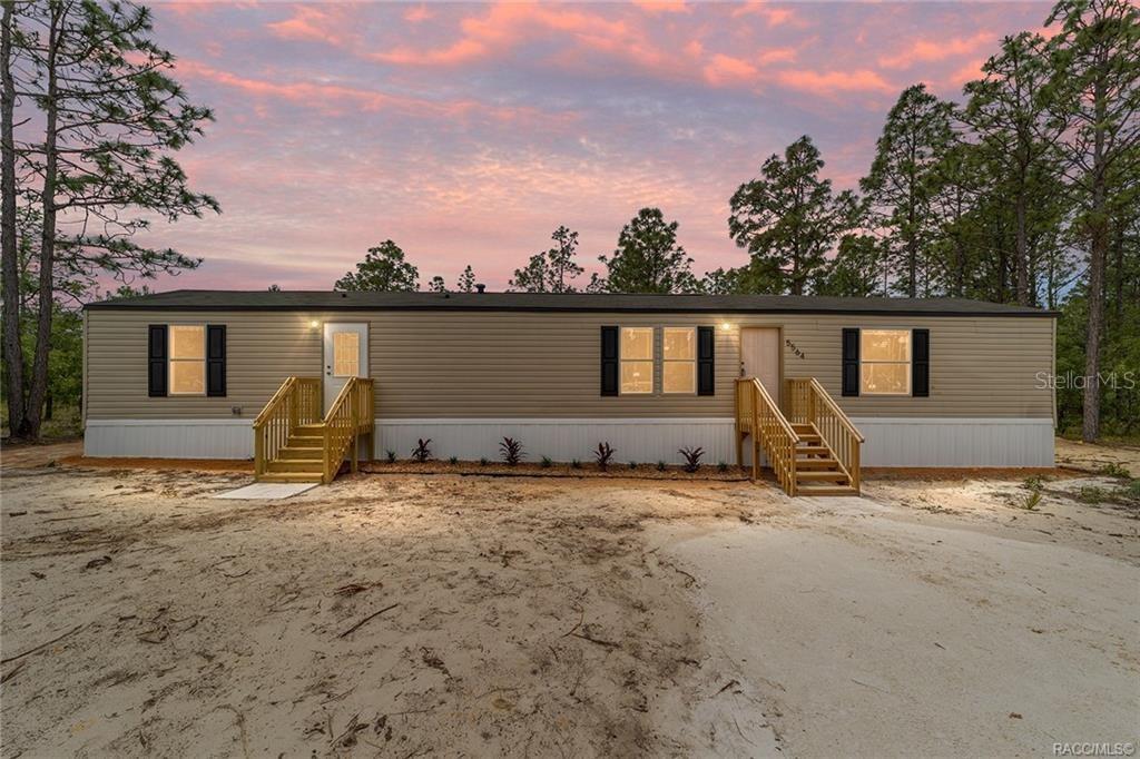 Charming New Home on 1 Acre Near Crystal River! Be the very first to live in this beautiful 3-bedroom, 2-bathroom manufactured home nestled on a spacious 1-acre lot. Enjoy the clean, modern design featuring warm neutral tones, stylish brown cabinetry, and sleek stainless steel appliances. The open, split-bedroom layout offers privacy and comfort, with durable flooring throughout—no carpet in sight! This property is move-in ready and eligible for USDA, FHA, and VA financing. With a well and septic system in place, you’ll enjoy lower utility costs. Conveniently located just a short drive to the scenic Crystal River, where you can enjoy boating, fishing, and natural springs. Don’t miss this opportunity for peaceful country living with easy access to town!