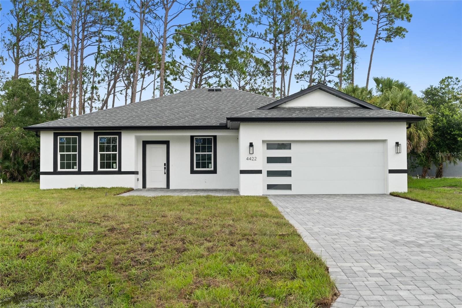 Under Construction. Home is fully completed, pending final inspection for Certificate of Occupancy. THIS PROPERTY QUALIFIES FOR CLOSING COSTS ASSISTANCE PLUS AN ADDITIONAL 1% INCENTIVE WHEN USING BUILDER’S PREFERRED LENDER
Brand new concrete block construction in the heart of North Port — no HOA, no CDD, and no flood zone (X). This beautifully crafted 4-bedroom, 3-bathroom home offers an elegant open floor plan with a epoxy finished two-car garage, and premium finishes throughout.
The gourmet kitchen features a large center island with waterfall-edge quartz countertops on both sides, soft-close cabinetry, stainless steel Samsung appliances — ideal for entertaining and everyday living. Luxury vinyl plank flooring flows throughout the home, offering style and durability.
The spacious primary suite includes his-and-hers walk-in closets and a bathroom with dual sinks and a glass-enclosed walk-in shower. A secondary bedroom includes a private en-suite bath, and a walk-in closet perfect for guests or multi-generational living. All bedrooms with blinds and modern celling fans.
Additional features include impact-resistant windows and doors, a smart thermostat, upgraded lighting, a water filtration system, and garage doors with glass panels that allow natural light in. Enjoy Florida living year-round on the covered lanai with a nicely sized backyard and extended paver driveway.
Easy access to I-75, commuting to Sarasota, Fort Myers, and top-rated Gulf Coast beaches like Siesta Key and Venice Beach. An excellent opportunity for homeowners and investors alike!
Schedule your private showing today!