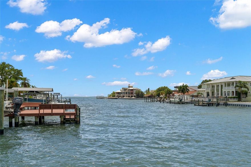 A boater's paradise! This incredible one story waterfront pool home is built according to the floodplain & situated on an extra wide/deep canal,(Sonia Lagoon) in Sunset Park, just minutes from the open bay! The floor plan takes advantage of the beautiful waterfront views from the moment you open the front door and captures the essence of Florida living at its best. Entertaining is a breeze with an open family room with a fireplace and informal dining area along with a chef's kitchen. The views from these rooms look out onto the enclosed patio with Saltillo tile overlooking the backyard, putting green, pool and waterfront. The spacious master suite overlooks the waterfront and enjoys a sitting area with French doors onto the porch, 2 custom walk-in closets plus a large bathroom. The home features wide plank wood flooring, impact windows, a split bedroom plan and loads of natural light. The dock and seawall were new in 2014 and there is a lift that will accommodate a 10,000 lbs boat. Roof and gas water heater were installed in 2017, A/C systems 2018 and 2021, pool pump 2020 and attic insulation 2021. Oversized 2 car garage. This home is ready for its new owner!