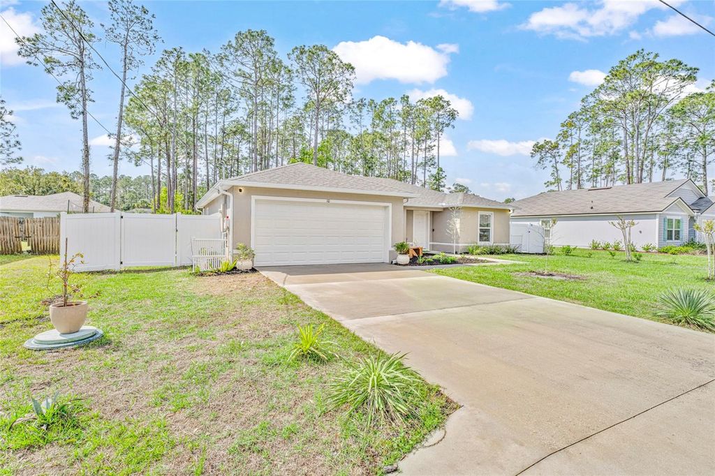 Photo of 10 Poinsettia Lane, Palm Coast, FL 32164 (MLS # FC317256)