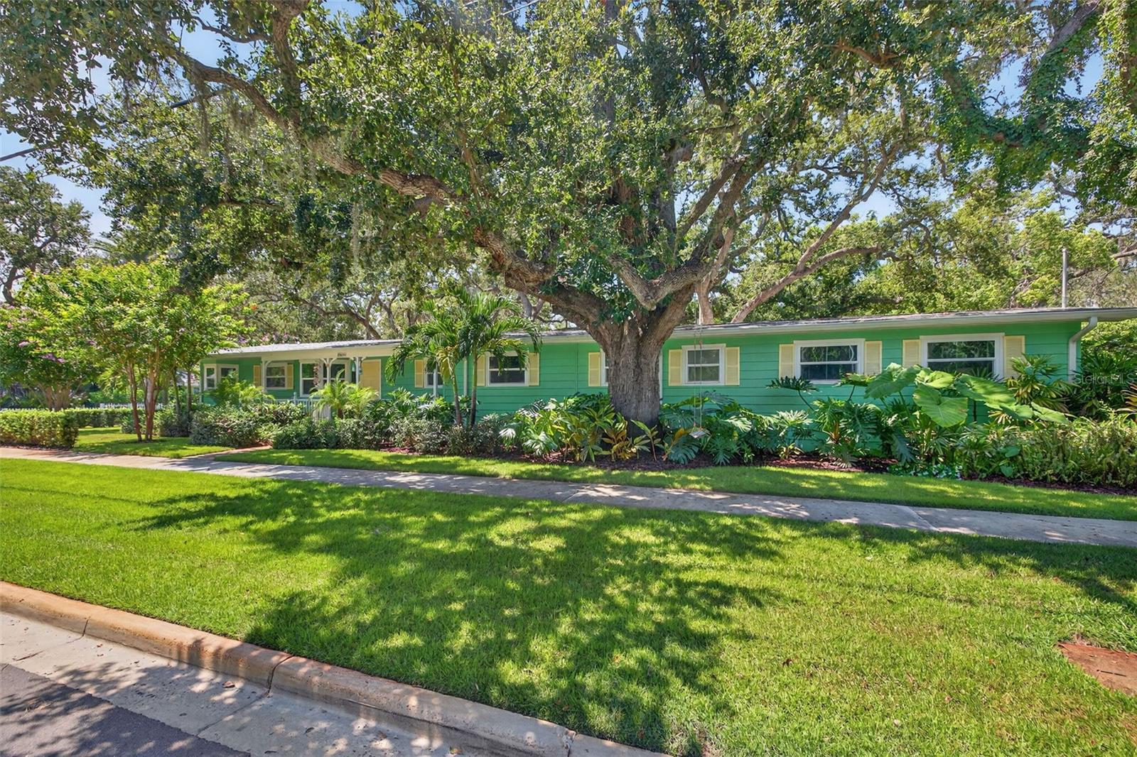 The Heart of Dunedin living at its best - Steps to Downtown Dunedin, the Sunset & the Pinellas Trail.
Located in the Heart of Dunedin, this home combines modern luxury conveniences with old style Florida charm. Tastefully renovated by a local highly recognized builder just 3 years ago.
The home wraps around the scenic backyard – a Tropical Oasis; with views from the Living Room, Kitchen, Family Room and Owner’s Suite.
At the heart of this property is the spacious gourmet kitchen – a chef’s dream for entertaining friends and family! The open floor plan seamlessly embraces the kitchen and dining areas. Luxury galore… High-end appliances: Natural Gas Viking stove, Viking Dishwasher, Viking Warming Drawer, Sub-Zero refrigerator/freezer, Microwave Drawer, RO water filter and custom designed cabinetry tastefully finished with an enormous quartz island.
The expansive owner’s suite with ensuite private bath, offers relaxation for the heart and soul with scenic views of the majestic oak trees in the serene tropical backyard.
This versatile floorplan offers flexible living space for family, guests, office, and even possibly an in-law suite. The luxurious guest bathroom has a freestanding soaking tub and separate shower.
The oversized 2 car garage with epoxy floors and an additional oversized workshop area has ample room for your golf cart and other hobbies.
This property sits on an expansive private double lot with the backyard as its own chapter; this charming real Florida old style lush backyard with majestic oak trees, mature landscaping and tropical greenery is your own private Tropical Oasis. The backyard is custom pavered with original old historic bricks, upscale lighting with uplight, and complete irrigation throughout. Large entertainment area with firepit and several sitting areas.
With a complete inside renovation in 2022 as well as exterior paint, gutters and gutter protectors from 2022, new roof from 2023 and new impact rated windows from 2025 all the major outside renovations has also been taken care of.
Enjoy breathtaking Gulf Coast sunsets from scenic Edgewater Drive or timeless entertainment at the Fenway, both just a block away. Walk or ride your golf cart to Dunedin’s charming downtown or explore Pinellas Trail.
This home truly combines luxury inside with outside charm. This is more than a home — it’s a lifestyle in one of Florida’s most beloved coastal towns.
Don’t miss the opportunity to own a piece of Dunedin in a neighborhood where houses like this seldom are for sale.
Book your showing now.