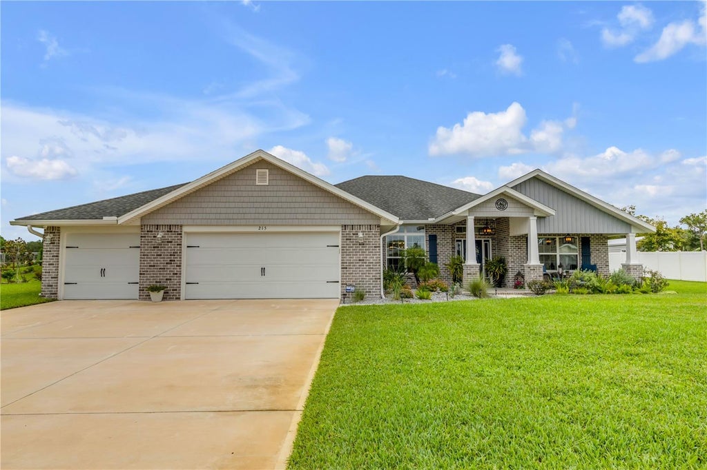 Photo of 215 Lagoon Mist Court, Oak Hill, FL 32759 (MLS # O6448257)
