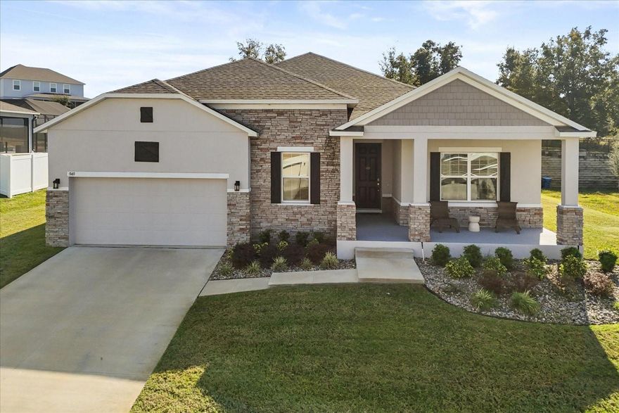 Energy-efficient living meets small-town charm in the heart of Polk County! This beautiful 3-bedroom, 2-bathroom home is tucked away on a quiet interior lot at the end of a cul-de-sac, offering extra privacy and a peaceful setting with no through traffic. Enjoy stunning lake views and fabulous sunsets from the welcoming front porch—your new favorite spot to unwind.

Step inside to an open living floor plan filled with abundant natural light, complemented by neutral paint and designer lighting throughout. The well-appointed island kitchen offers great workspace for cooking and entertaining. Wood-look ceramic tile flows through the main living areas for style and easy maintenance. A spacious front office provides the perfect dedicated workspace.

Retreat to the serene primary bedroom featuring an ensuite bath and walk-in closet. Two additional bedrooms and a full bath offer comfort for family or guests. Thoughtfully designed for efficiency, this home includes solar panels, a water softener, and a Tesla backup battery that powers half the home during outages. The 3-car tandem garage offers generous storage space.

Enjoy peaceful backyard views from the screened-in patio, with plenty of green space for pets and play. Located in an established neighborhood with mature trees, this home offers the true small-town feel while still providing quick access to HWY 27, local shops, dining, parks, beaches, and nearby cities. A perfect blend of comfort, efficiency, and convenience!