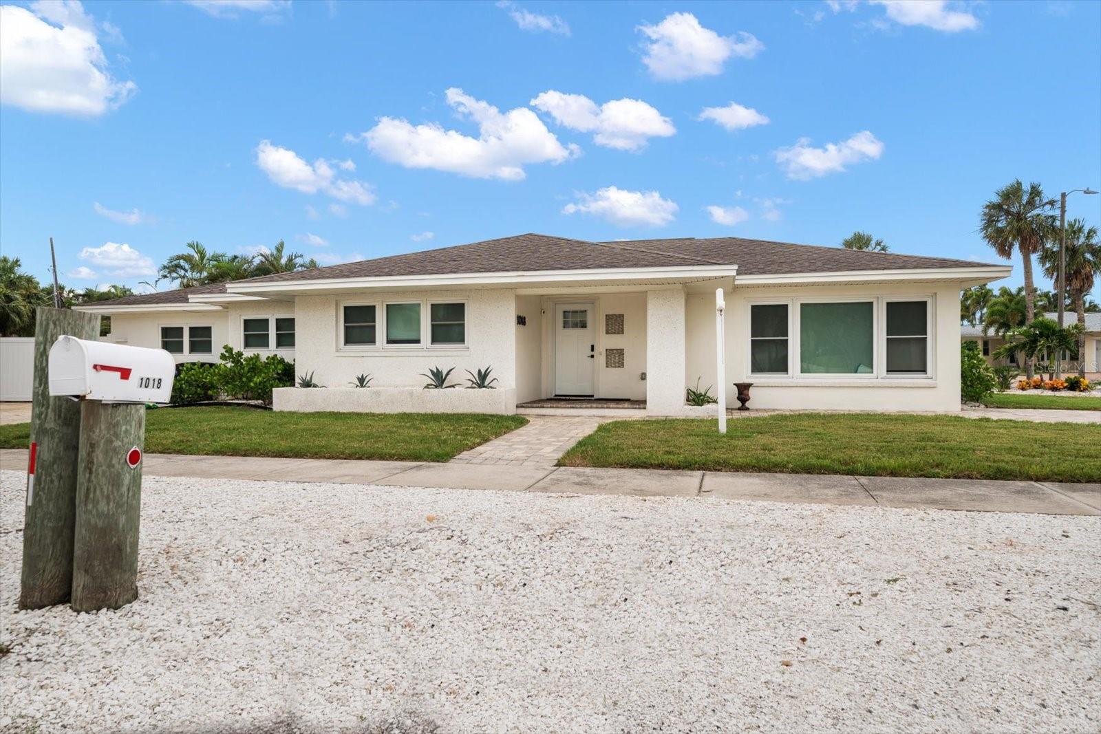 Your Clearwater Beach Dream Home – Fully Renovated Coastal Oasis in Carlouel
Welcome to 1018 Bay Esplanade, a rare gem nestled in the heart of Clearwater Beach’s exclusive Carlouel neighborhood, where charm, luxury, and location meet. Set on an oversized 9,392 sq ft corner lot just steps from the private beach access, this fully reimagined 4-bedroom, 3-bathroom estate offers the ultimate in coastal living. Renovated from top to bottom in 2025, no detail has been overlooked. The brand-new chef’s kitchen is a showstopper—featuring custom white shaker cabinetry, stunning quartz countertops, a natural gas range, and sunlight pouring into the open dining space. Whether you’re preparing casual meals or entertaining guests, this kitchen is the heart of the home. The adjacent spacious living room provides an ideal setting for relaxing or entertaining, with abundant natural light and coastal charm throughout. The oversized primary suite is a true retreat with a spa-inspired bathroom with laundry closet, walk-in closet, and direct access to the backyard. One additional large bedroom also features its own en-suite bathroom, offering comfort and privacy for guests or multi-generational living. A third bedroom is generously sized for two queen beds, while the fourth is perfect as a home office or guest room. All three bathrooms are newly renovated with modern, high-end finishes. Step outside and you’ll find a resort-style backyard designed for year-round enjoyment. Completed in 2025, the lush landscaping surrounds your 2023 saltwater pool and spa, featuring smartphone-controlled automation, gas heating, and a covered patio with ceiling fans for relaxing evenings under the stars. Fire up the directly piped natural gas grill, rinse off in the outdoor shower with hot and cold water, and unwind in your private tropical sanctuary.
This home also features new hurricane-impact windows throughout, brand-new appliances and A/C unit, and a full suite of smart home upgrades, including keyless front door locks, a smart thermostat, and security cameras. With zoning that allows for 30-day minimum rentals, the home offers both coastal living for your family, and investment potential.
All of this, tucked away in the peaceful, golf-cart-friendly Carlouel enclave, yet just minutes from the vibrant dining, shops, and nightlife of Clearwater Beach and Pier 60. This is not just a home — it’s a lifestyle. One you’ll only find here, at 1018 Bay Esplanade. Schedule your private showing today.