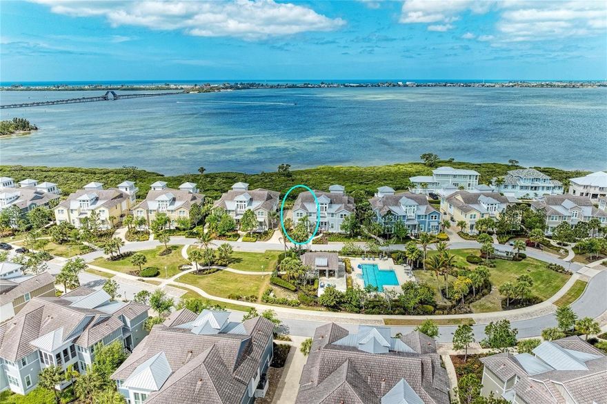 One or more photo(s) has been virtually staged. Spectacular, dazzling and breath-taking…are just a few words that could be used to describe the unbelievable views from this stunning home.  Welcome to your beautiful home with unparalleled water view of Anna Maria Sound and out into Tampa Bay in the luxurious, gated, much sought after, coastal resort community of Harbour Isle on Anna Maria Sound.  This light and bright Bermuda floor plan features 2002 square feet of gorgeous living space — including two bedrooms, two baths and an office/den (which can be easily converted into a third bedroom) located in the front of the home and in the rear, overlooking expansive water views, is the state of the art kitchen, dining area, living room and sunroom.  The expansive open living area features the kitchen (with upgraded cabinets, granite, stainless steel appliances with double oven and a custom walk-in pantry) and a large living and dining area custom made for entertaining.  Crown molding, tray ceiling in bedroom, upgraded lighting, custom window treatments, vaulted ceiling in living room, custom closet and wood and tile flooring are just a few of the upgraded feature in the home. The roomy Owner’s suite features walk-in closet, double vanities, linen cabinet, large shower and separate water closet.  Other important features in the home is an oversized two-car garage where you can access your private home elevator. While inside the gates at Harbour Isle, explore two miles of neighborhood walking trails and stroll to the nearby neighborhood pools with outdoor grills, cabanas, fire pit and kayak launch for the 38-acre lake.  End the day with an incredible sunset at the 23,000 square foot Beach Club overlooking Anna Maria Sound.  The Beach Club features resort-style amenities with the Sky Bar, Lounge, Pavilion, Fitness Center, Yoga Lawn, Event Lawn, resort pool, hot tub and a private beach to launch a kayak in the Sound.  Just outside the gates of Harbour Isle you’ll find the Margaritaville inspired Compass Hotel, Safe Harbour Marina with wet and dry storage and Floridays waterfront tiki restaurant.  Cross the Manatee Bridge and you’re on Anna Maria Island with its sugar sand beaches, over 30 restaurants and island charm.  It’s time to start living your best life.  Live, relax, enjoy an active lifestyle in award-winning Harbour Isle. Some photos are virtually staged.  The home comes with minimal furnishings.