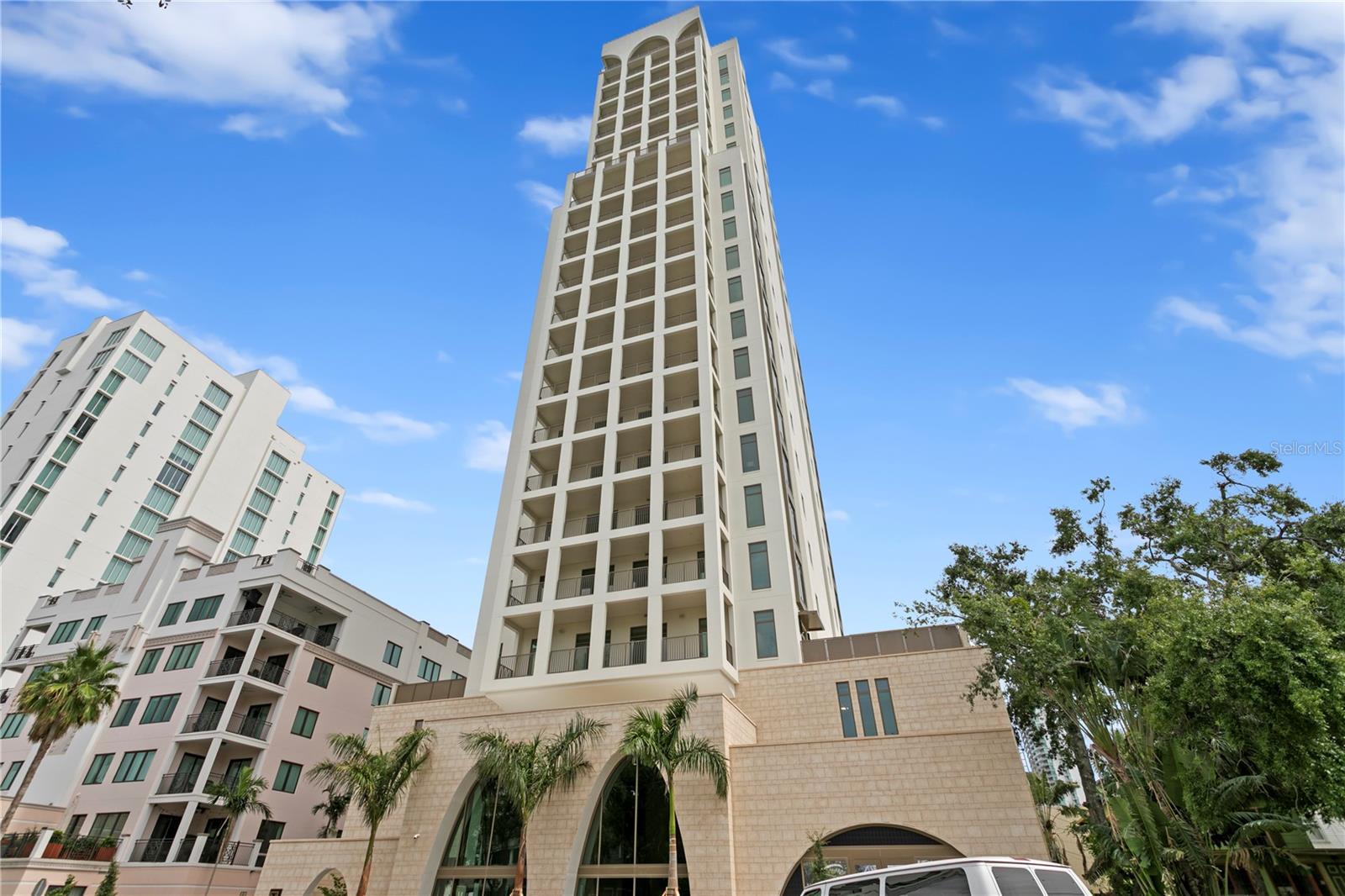 Now complete and ready for immediate occupancy, The Nolen introduces a rare opportunity to own one of only 31 luxury residences in this boutique 23-story tower rising above Downtown St. Petersburg. Developed by the acclaimed DDA Development and Backstreets Capital, this architectural gem features private elevators opening directly into each home, with no shared walls, 10’ ceilings, expansive 38-foot outdoor terraces, and floor-to-ceiling impact-rated glass providing breathtaking city, water, and sunset views.
The entry is a dramatic stone-clad lobby with soaring 21-foot arched windows and private residence elevators set the tone for elevated living from the moment you arrive. Residents enjoy concierge service, private climate-controlled storage, and two garage parking spaces (EV-ready) and the fourth-floor amenity level elevates everyday living with a saltwater pool and spa, covered cabanas, fire pits, BBQ station, club lounge, and a fully equipped fitness center. Modern upgrades include a whole-building generator, energy-efficient infrastructure, and an integrated water softening system.
1201 Interior Finishes & Features: Wide-plank light European oak hardwood floors run seamlessly throughout the entire space providing a bright and contemporary foundation. Kitchen: Waterfall-edge countertops in honed white and beige-veined quartz provide an elegant, marble-inspired look with the durability of engineered stone. Thermador appliances, a wine fridge, an induction cooktop, and a deep granite farmhouse sink. Kitchen Cabinets: High-gloss flat-panel cabinetry in a soft buttery cashmere color tone delivers clean lines and ample storage, paired with under-cabinet LED lighting for a polished designer finish.
Bathrooms: The spa-inspired bathroom features a floating dual-sink vanity with glossy white flat-panel drawers and sleek wall-mounted chrome fixtures. Large-format porcelain wall tiles with a soft marble pattern wrap the bath and shower surround, complemented by a textured accent wall in the shower for depth and sophistication featuring Brizo fixtures, freestanding soaking tubs, Toto toilets, and oversized walk-in showers. Frameless shower glass-enclosed shower with dual rainfall and wall-mounted shower heads, linear drain, recessed storage niches, and sleek chrome controls.
This is your chance to own a thoughtfully designed, NGBS-certified green home in one of St. Pete’s most exclusive addresses—just steps from Beach Drive, dining, marinas, and the waterfront parks.