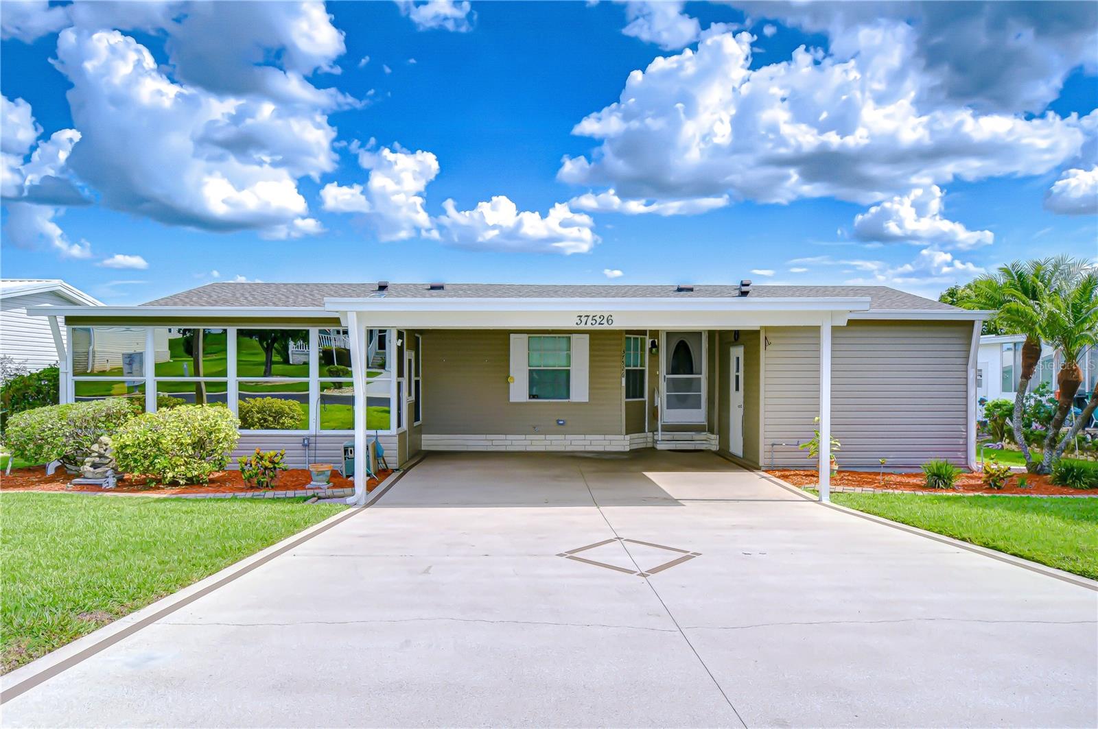 Welcome to the Florida lifestyle you've been dreaming of! Located in the highly desirable Grand Horizons Community, this beautifully maintained 3-bedroom, 2-bath home offers an impressive blend of comfort, functionality, and charm. From the moment you arrive, you'll appreciate the spacious two-car carport—perfect for extra parking and protection from the sun. To the left, a gorgeous Florida room invites you to sit back and enjoy your morning coffee or unwind with the evening breeze. To the right, a large storage shed/ workshop provides ample space for hobbies, tools, or DIY projects. Inside, the bright and open floor plan offers a welcoming atmosphere with an easy flow from the living room to the dining area—an ideal space for entertaining or casual living. The kitchen is thoughtfully designed with abundant cabinetry, generous counter space, a pantry, and a cozy breakfast nook perfect for everyday meals. The in-home laundry closet is conveniently tucked away and comes equipped with a washer and dryer. The primary bedroom comfortably fits a king-size bed, while the guest bedrooms give you generous space for larger furniture—perfect for overnight visitors or additional flex use. Enjoy all the amenities Grand Horizons has —whether you're lounging by the pool, joining a shuffleboard match, or attending events at the clubhouse, there's always something to do. Whether you're looking for a full-time Florida home or a seasonal escape from the cold, this well-appointed property is ready to welcome you. Schedule your private showing today and discover all that Grand Horizons living has waiting for you!