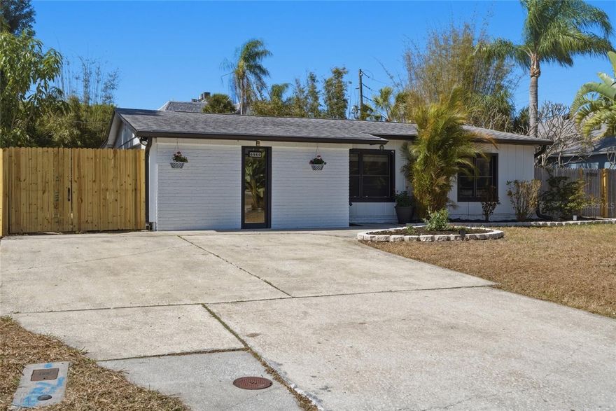 Welcome to a beautifully refreshed home where thoughtful updates, lush landscaping, and major system improvements come together in perfect harmony. Every detail has been carefully considered so you can simply move in and enjoy.  Stunning, Updated Kitchen!  The heart of the home shines with a full suite of brand-new appliances, including a refrigerator, stove, dishwasher, and microwave — blending modern convenience with everyday functionality. Whether you’re preparing weeknight dinners or entertaining friends, this kitchen is ready to impress.
Beautifully Updated Bathrooms! Both bathrooms have been tastefully refreshed with new vanities, sinks, and toilets, complemented by updated lighting fixtures that create a clean, bright, and contemporary feel. Fresh & Inviting Interior!  Enjoy fresh interior paint throughout, enhanced by updated lighting and new ceiling fans that add comfort and style to every room. The home feels crisp, cohesive, and move-in ready.  Major Systems Already Done for You!  Peace of mind comes standard with:  Roof replaced September 2020. A/C system replaced in 2017. Hot water heater replaced November 2025. These significant upgrades mean fewer worries and more enjoyment for years to come.
Exceptional Outdoor Living & Lush Tropical Landscaping!  Step outside to a freshly painted exterior and updated soffit lighting that enhances the home’s curb appeal. The rear deck has been recently re-stained with several boards replaced — creating a welcoming outdoor retreat perfect for morning coffee or evening gatherings.  The grounds are truly special. Lovingly maintained for nearly a decade, the landscaping offers privacy, beauty, and remarkably low maintenance:  Professionally installed clumping bamboo by Island Bamboo (in-ground 8+ years; non-invasive and naturally contained).  Buddha bamboo along the rear fence for added privacy (grows approximately 8 feet tall).  Large bird of paradise and a striking ponytail palm.  Multiple mature plumeria trees that produce abundant blooms.  Two established Confederate jasmine plants.  Dutchman’s pipe vine draped over the shed, attracting beautiful swallowtail butterflies.  Mature, fruit-producing mango tree (approximately 3 years established).  Best of all, the landscape is designed to be low-to-no maintenance with no irrigation system required.
This home offers the rare combination of stylish updates, solid major systems, and a private tropical setting — all thoughtfully curated and ready for its next owner to enjoy.