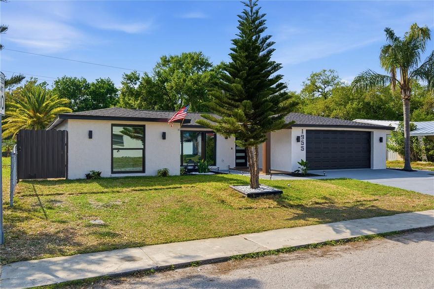 “Attention investors and discerning buyers! This luxury property in Holiday is a once-in-a-lifetime opportunity just 7 min left to the beach! Completely rebuilt in 2026, everything is brand new: windows, doors, roof, air conditioning with modern lineal ducts—all completed in 2026. This home boasts a brand-new 2026 water heater, luxury ceramic bathrooms, and stunning ceramic flooring throughout. The terrace, with its wood finish and gazebo overlooking the water, is a private oasis. With three spacious bedrooms and three bathrooms, including a perfect in-law suite, every detail exudes sophistication. Modern cabinetry with quartz countertops creates a luxurious ambiance in the kitchen and throughout the open living space. The home also features a sleek modern garden, a fully updated electrical system (2026), and a brand-new electrical panel. This home is a smart home, with integrated speakers and a premium sound system for the ultimate living experience. This is a turnkey masterpiece—perfect for those seeking elegance, cutting-edge technology, and modern design. Don’t wait—schedule your tour today and join the elite who will call this home their own!”