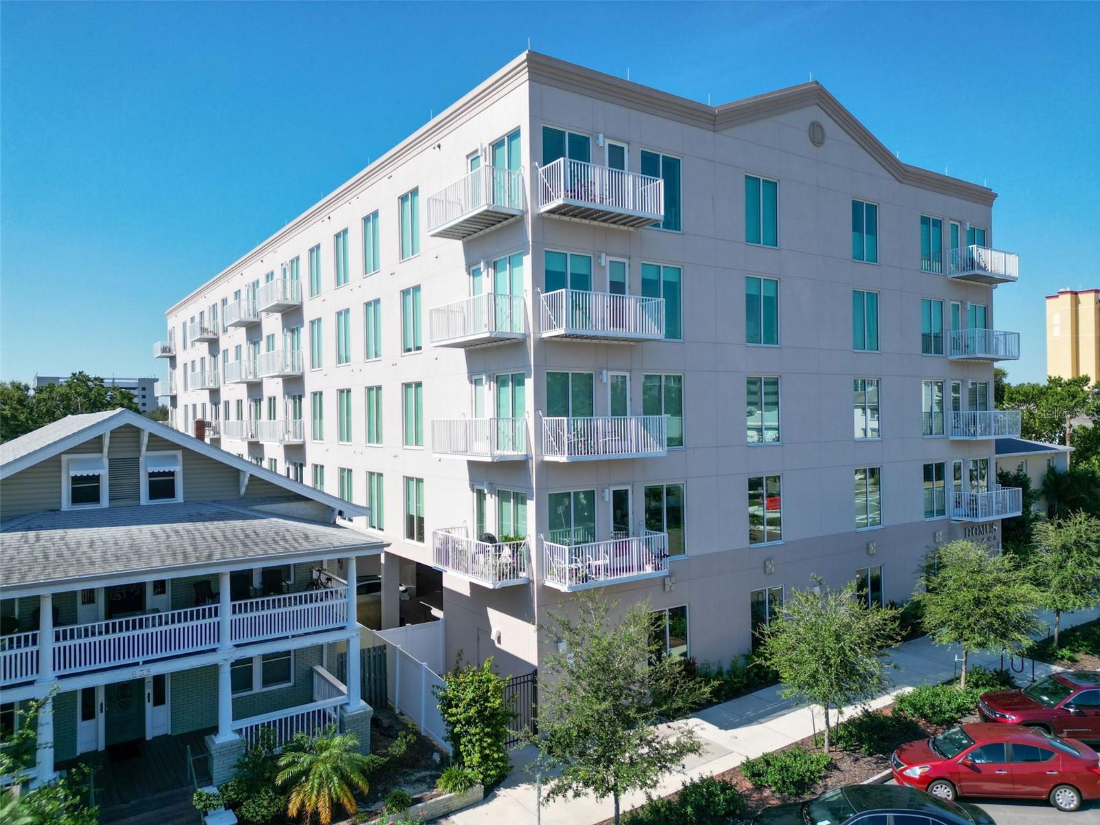 One or more photo(s) has been virtually staged. Elevate Your Downtown St. Pete Lifestyle – Contemporary 3-Bedroom Corner Residence
Discover the perfect blend of luxury and downtown sophistication in this stunning 3-bedroom, 3-bathroom corner unit, built in 2023 and perfectly positioned in one of St. Petersburg’s most coveted neighborhoods. Spanning 1,650 square feet with soaring 9.5-foot ceilings, this southwest-facing home is bathed in natural light through expansive 8-foot hurricane-impact windows and a balcony door, offering both beauty and peace of mind in a non-flood, non-evacuation zone.
The gourmet kitchen is a chef’s dream, featuring Bosch stainless steel appliances, quartz countertops, soft-close solid wood cabinets, under-cabinet lighting, a pantry closet, and a large center island with seating—ideal for entertaining or casual dining. The king-sized primary suite is a true retreat, complete with an oversized custom walk-in closet, spa-like en-suite bath with double vanities, Carrara tile, and a seamless walk-in shower.
Thoughtfully designed for privacy, the split floor plan includes a second bedroom with its own en-suite bath and custom walk-in closet, while the versatile third bedroom can function as a home office, gym, or guest suite, complemented by a third full bath just off the main hallway. All three closets in this condo have been custom built and the third bedroom features a convenient murphy bed as well as a built in desk. A spacious laundry room, tucked near the entry, boasts a full-size washer and dryer along with custom cabinetry for additional storage.
This residence comes with a secure, assigned parking space in the gated under-building garage. The building offers exceptional amenities, including a community room, fitness center, outdoor patio, and a dog run with a convenient washing station.
Located just blocks from Central Avenue and Beach Drive, you’ll enjoy easy walking access to award-winning dining, shopping, museums, parks, the St. Pete Pier, and the waterfront. For outdoor enthusiasts, cycling and pedestrian trails are nearby, and the SunRunner provides quick access to St. Pete Beach. This move-in ready home invites you to experience the vibrant energy of downtown living while enjoying comfort, style, and convenience at every turn.