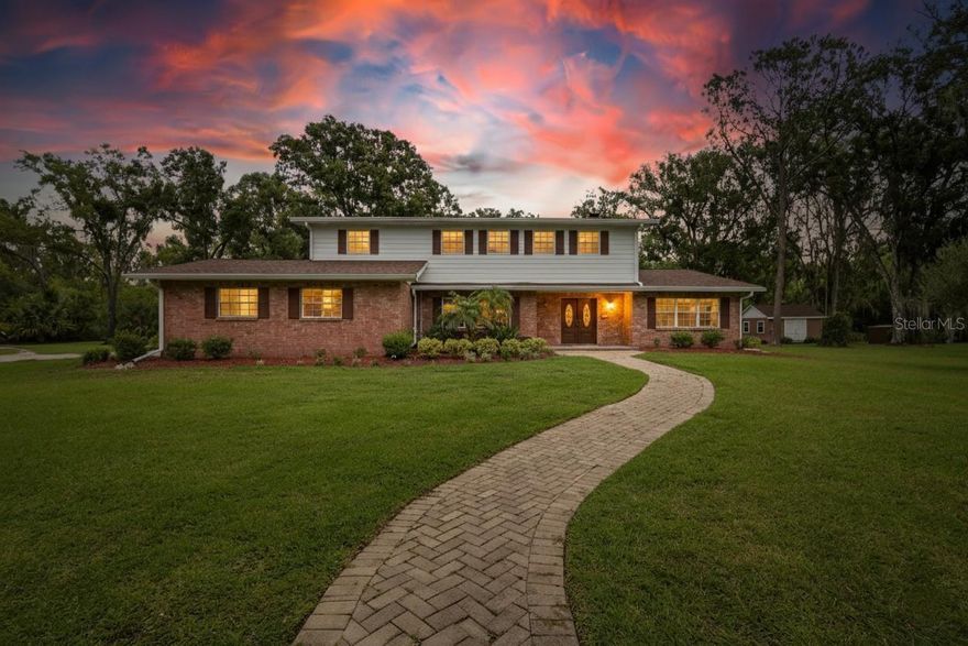 Discover a rare opportunity to own approximately 4.5 acres inside the city limits, complete with a private pond and charming bridge. This remodeled two-story home offers 5 bedrooms, 2.5 bathrooms, and modern updates throughout. The kitchen features granite countertops, while the spacious floor plan includes a gas fireplace, inside laundry with convenient chute, and an epoxy-finished two-car garage. Newer roofs and HVAC systems provide peace of mind. The detached guest suite is ideal for extended family or visitors, offering a full kitchen, bathroom, washer/dryer hook up, and its own one-car carport. Additional highlights include a storage shed, fully fenced property, and golf cart and trailer to convey with a full-price offer. Washer and dryer remain with the home with full price offer as well. This unique property combines country privacy with city convenience—complete with ample parking, fenced grounds, and multiple living options. Truly a must-see estate with character, function, and flexibility.