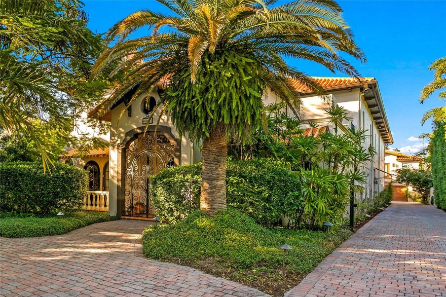 Discover the perfect blend of elegance, craftsmanship, and comfort in this classic Mediterranean estate, built with enduring quality and architectural grace. Constructed entirely of block and poured concrete, this home was designed to stand the test of time, in both structure and style.
Step inside to a grand two-story living room, where soaring ceilings, graceful archways, and abundant natural light create a breathtaking first impression. 
Perfect for entertaining, this home’s open design connects every room to the pool area, where lush tropical landscaping provides a serene, private retreat. Imagine evenings spent dining al fresco or weekends relaxing poolside surrounded by the sound of rustling palms.
The spacious eat-in kitchen is ideal for both casual family meals and lively gatherings, offering generous prep areas and seamless flow to the adjoining living spaces.
A gated drive leads to a three-car garage, topped by a second-floor game room complete with wet bar—the ideal spot for movie nights, game days, or guest entertaining. Every detail has been considered for comfort, privacy, and effortless luxury.
Located in one of the area’s most popular and walkable neighborhoods, this home offers tranquil seclusion without sacrificing convenience. You’re just minutes from the international airport, fine shopping, and both public and private top-ranked schools—making it the perfect sanctuary for modern living.
This timeless Mediterranean residence captures the essence of refined Florida living: classic architecture, lush surroundings, and a sense of home that endures for generations.