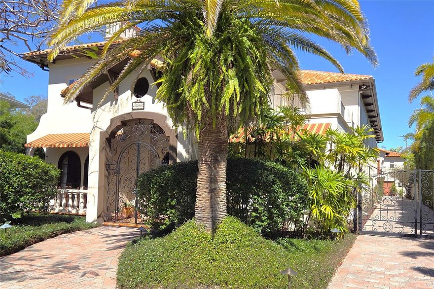 Discover the perfect blend of elegance, craftsmanship, and comfort in this classic Mediterranean estate, built with enduring quality and architectural grace. Constructed entirely of block and poured concrete, this home was designed to stand the test of time, in both structure and style.
Step inside to a grand two-story living room, where soaring ceilings, graceful archways, and abundant natural light create a breathtaking first impression. 
Perfect for entertaining, this home’s open design connects every room to the pool area, where lush tropical landscaping provides a serene, private retreat. Imagine evenings spent dining al fresco or weekends relaxing poolside surrounded by the sound of rustling palms.
The spacious eat-in kitchen is ideal for both casual family meals and lively gatherings, offering generous prep areas and seamless flow to the adjoining living spaces.
A gated drive leads to a three-car garage, topped by a second-floor game room complete with wet bar—the ideal spot for movie nights, game days, or guest entertaining. Every detail has been considered for comfort, privacy, and effortless luxury.
Located in one of the area’s most popular and walkable neighborhoods, this home offers tranquil seclusion without sacrificing convenience. You’re just minutes from the international airport, fine shopping, and both public and private top-ranked schools—making it the perfect sanctuary for modern living.
This timeless Mediterranean residence captures the essence of refined Florida living: classic architecture, lush surroundings, and a sense of home that endures for generations.