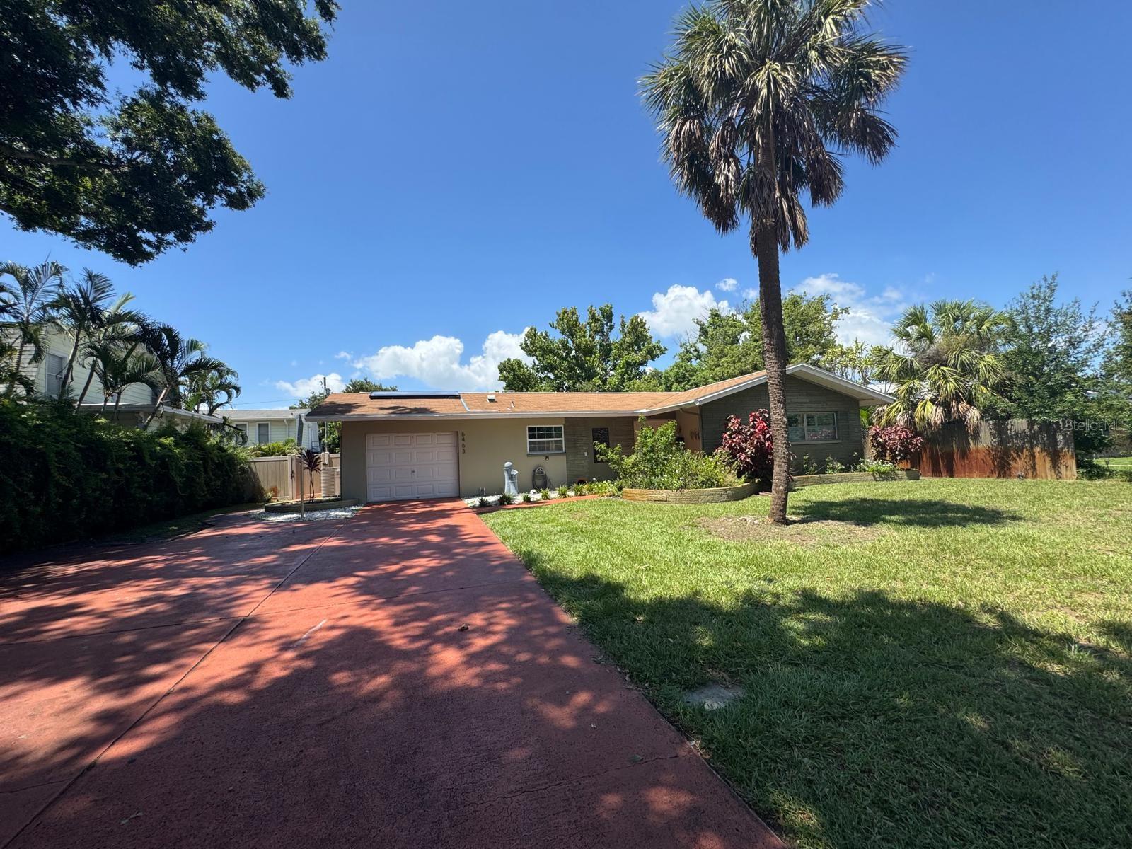 Welcome to this beautifully updated 4-bedroom, 2 1/2-bath pool home located in the heart of St. Petersburg! NO FLOOD!! This charming south-facing property features a spacious open floor plan, modern kitchen with quartz countertops and stainless steel appliances, and offers a second kitchen area with an AC Split granite countertops as well. Home features a bright living area perfect for entertaining. The primary suite offers a private en-suite bathroom and ample closet space. Enjoy Florida living with a large fenced backyard, ideal for pets, gardening, or creating your dream outdoor oasis. Situated just minutes from Gulf beaches, vibrant downtown St. Pete, parks, shopping, and dining. Don’t miss your chance to own this move-in ready gem in a prime location!