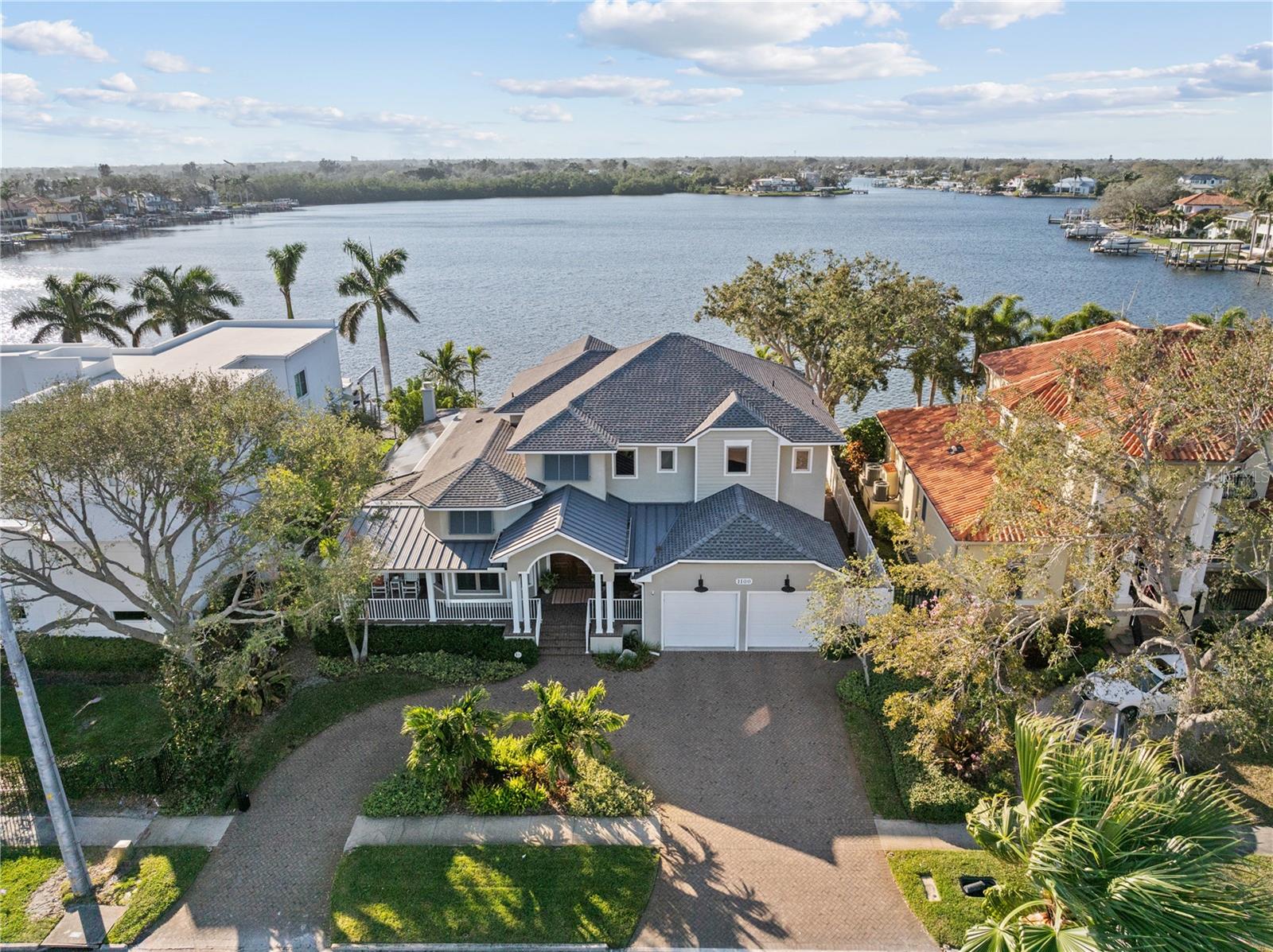 Under contract-accepting backup offers. Located along the open water of Smacks Bayou, this custom-built waterfront home in Snell Isle offers comfort, convenience, and a boatload of fun for your Florida lifestyle. Designed with family and entertaining in mind, this 4-bedroom, 3.5-bathroom home showcases soaring ceilings, rich cherry hardwood floors, and hurricane-impact windows and doors, ensuring both beauty and peace of mind.
The first-floor primary suite opens to the covered back porch with a cozy fireplace, perfect for unwinding as the sun sets over the bayou. The heart of the home is the gourmet kitchen, where a Thermador six-burner gas range with double ovens, Sub-Zero refrigerator, walk-in pantry, prep sink, custom solid wood cabinetry, and quartz countertops create a space that is as functional as it is stunning. Views of the water can be captured from a wall of doors in the great room. The private home office is the ideal space to escape and get work done.
Upstairs, the home offers ample space for relaxation and entertainment, featuring a spacious den that leads to an oversized covered terrace. Three additional bedrooms and two full bathrooms complete the second floor, providing privacy and comfort for family or guests.
Outside, the resort-style backyard is designed for year-round enjoyment and the landscaping creates the privacy you desire. The outdoor kitchen, saltwater pool, and spa set the stage for unforgettable gatherings, while the composite dock (2018) with power, water, and two boat lifts (16,000 and 4,000 lbs) offers convenient access to Tampa Bay. Additional features include an oversized two-car garage extra room for storage, three AC units (2023 & 2024), GAF roofing (2020), two tankless water heaters, solar panels (2020 paid in full), and so much more. Everything on this home has been well-maintained and upgraded.
Located just minutes from Downtown St. Petersburg, fine dining, museums, waterfront parks, and the Vinoy Golf Club, this exceptional home offers is perfect for someone seeking an active boating lifestyle on a quiet street in one of the area's most sought-after neighborhoods.