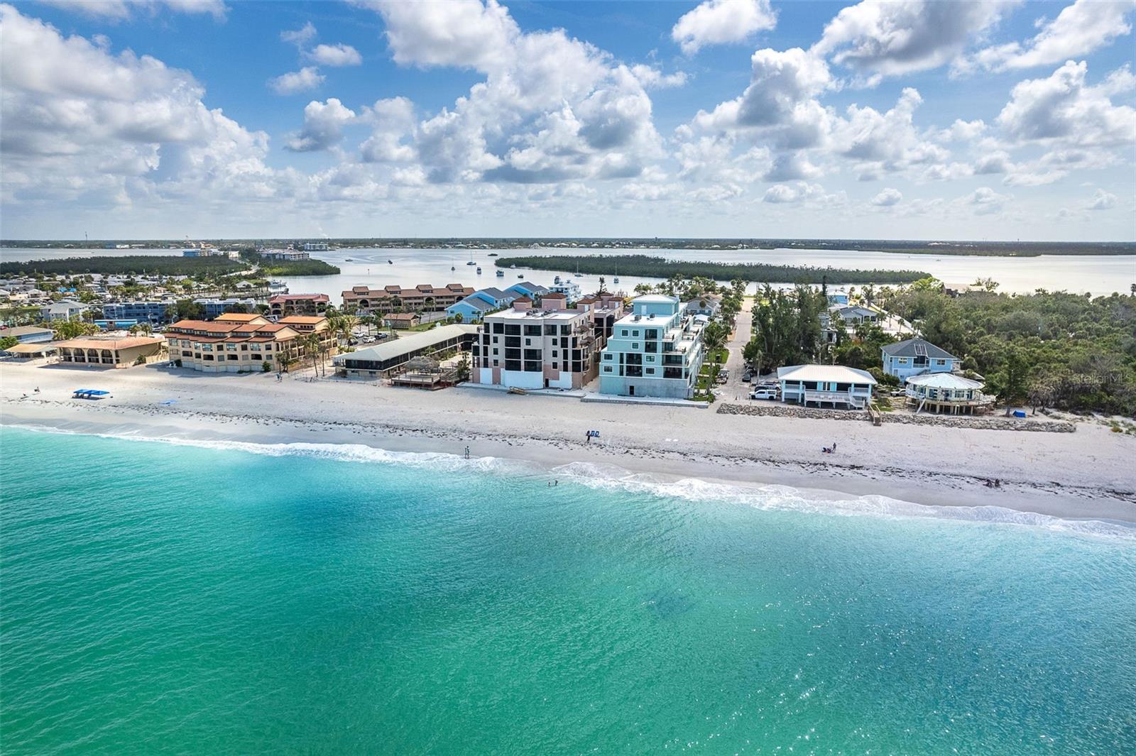 GULF ACCESS AND VIEWS, STEPS TO THE BEACH! Enjoy the Gulf Coast lifestyle at The Palms of Manasota Key with beach access and partial Gulf views from your Balcony, Living Room, and Primary Bedroom. The Palms of Manasota Key is a special place offering a lifestyle like no other. Never miss a sunset with your toes in the sand. Walk or take advantage of free golf cart service to local restaurants, shops, and the seafood market. Manasota Key is famous for its old Florida charm, and quiet, relaxed, comfortable pace. Here you can experience world-class fishing, boating, kayaking, paddle boarding, golfing, and dining in the heart of Englewood and surrounding villages of Venice and Boca Grande. This meticulously maintained, second-floor residence offers incredible views of the sapphire blues and emerald greens of the beautiful Gulf waters. The interior finishes include wood plank tile flooring, stainless appliances plus granite tops in the kitchen and quartz in the baths. Lounge by the heated pool or relax on your balcony with the peaceful sound of waves lapping the shore. This stunning residence is ready for immediate enjoyment. Furnishings available under separate agreement. Do not miss this opportunity!