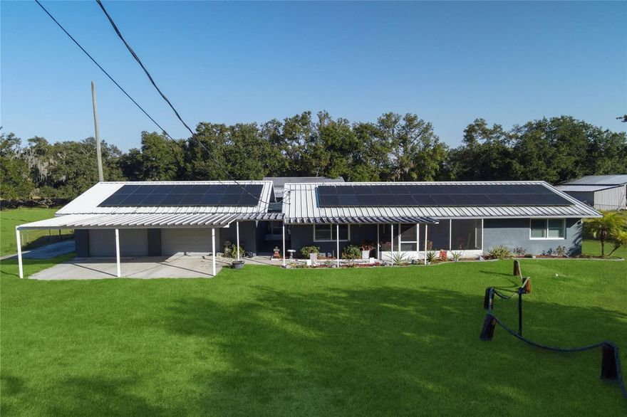 This beautiful, fully remodeled pool home sits on a spacious one-acre lot. Enjoy an open-concept living and kitchen area that’s perfect for entertaining. The outdoor oasis includes a 30×30 pole barn, a fully enclosed gym with all equipment included, a gazebo featuring a fire pit, and a separate enclosed sitting area. Relax year-round on the screened pool lanai with brand-new pool equipment. Recent upgrades include a new A/C system with all-new ductwork, energy-efficient insulated windows, a cozy electric fireplace in the living room, a tankless water heater, and owned solar panels for lower electric bills. No HOA or CDD fees! Homes like this don’t come on the market often — schedule your private showing today before this rare opportunity is gone!