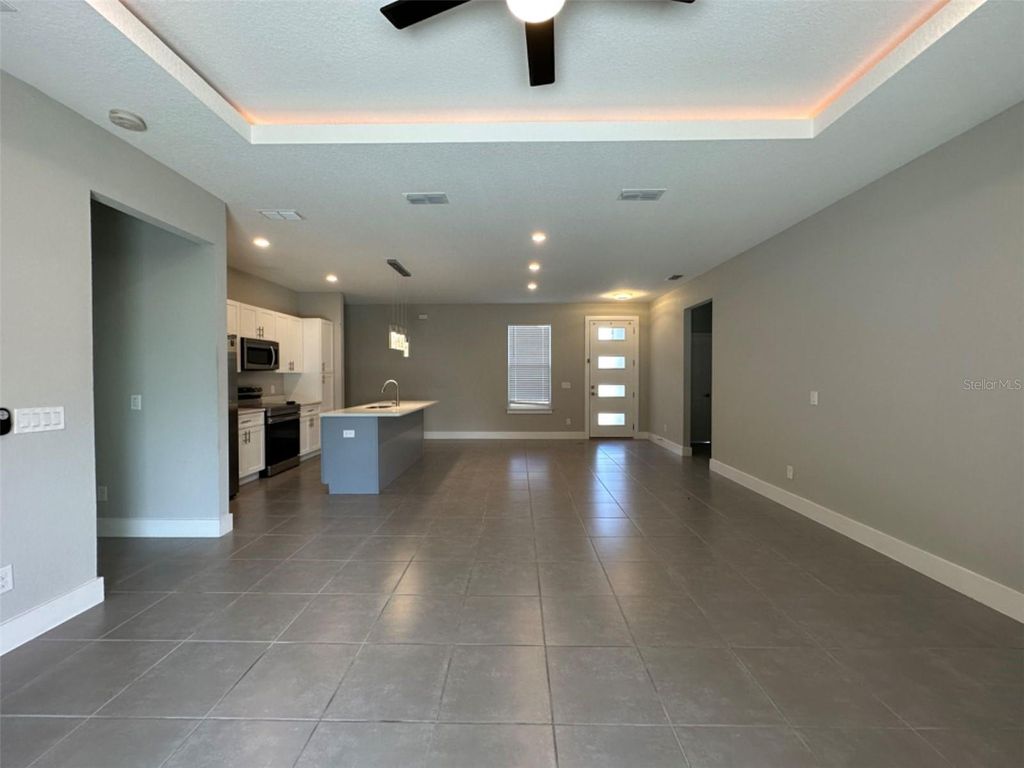 Photo of 207 Begonia Lane, Poinciana, FL 34759 (MLS # S5147428)