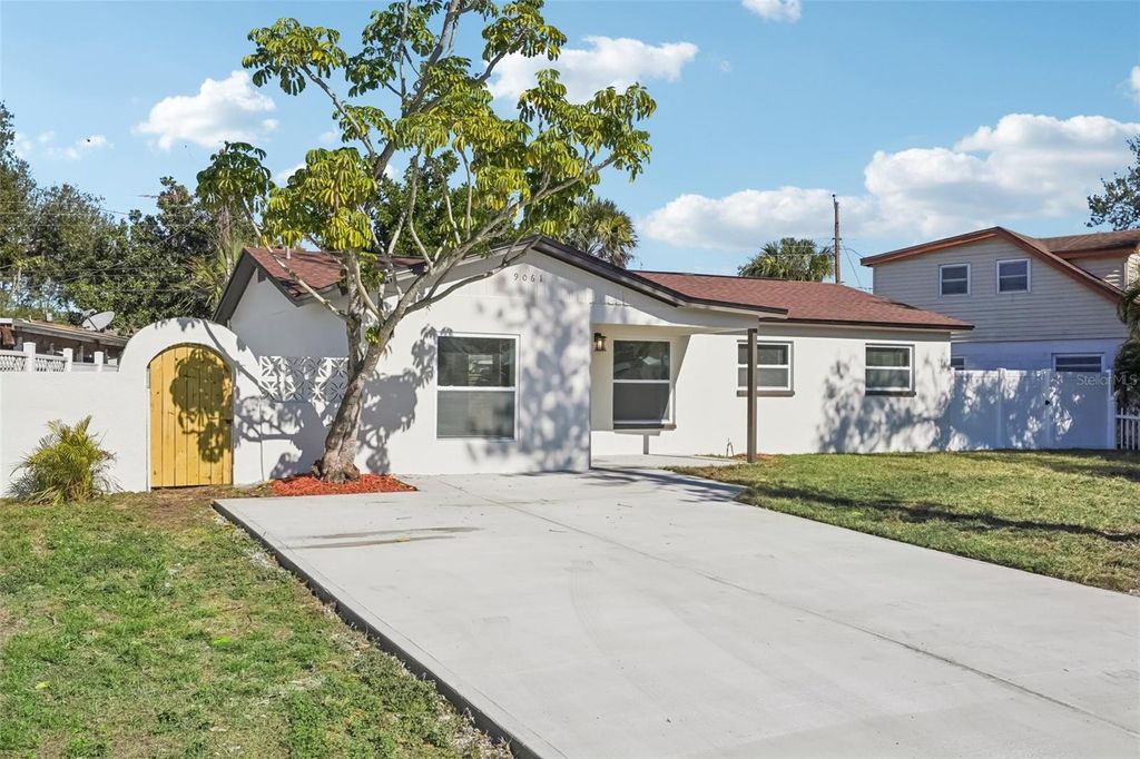 Photo of 9061 Sunrise Drive, Largo, FL 33773 (MLS # TB8466442)