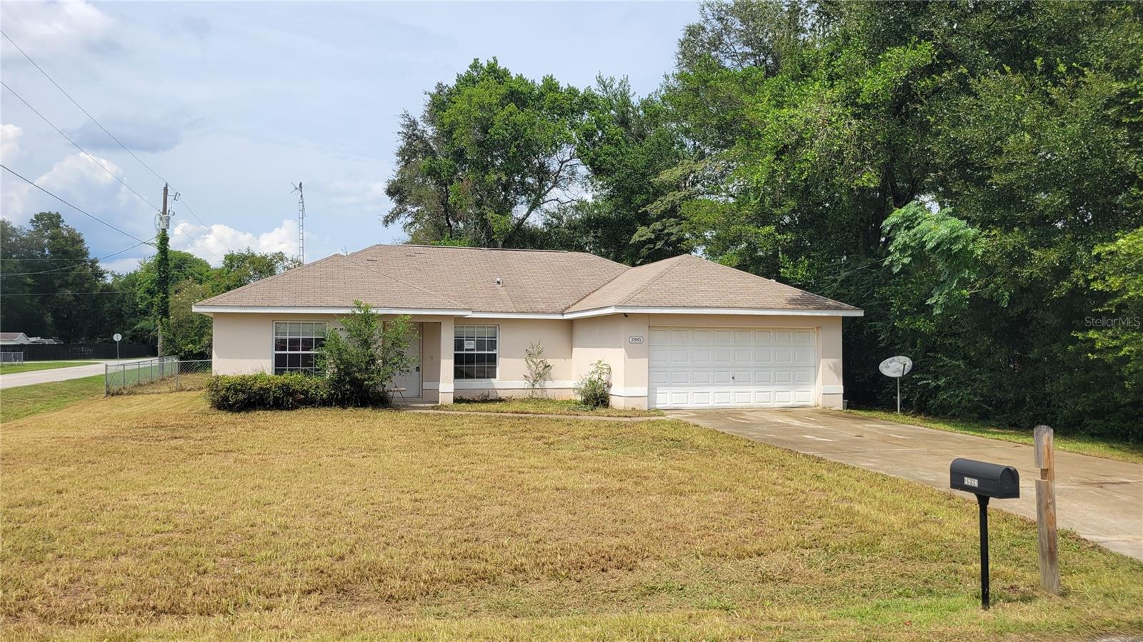 Don’t miss this 3-bedroom, 2-bathroom block home nestled in Summerfield, FL, just minutes from The Villages, Belleview, and Ocala. Step inside to find sanded and sealed concrete flooring throughout, offering a modern, durable, and easy-to-maintain finish. The high ceilings, large living area, and split floor plan provide a spacious and open feel, with bedrooms offering plenty of room to relax. The home features a gally kitchen and two full bathrooms. This home is ready for your creative vision and updates — the perfect blank canvas for your dream remodel. Additional features include a 2-car garage and fully fenced backyard, private well for water and septic for sewer. Don't miss this opportunity—schedule your private showing today!