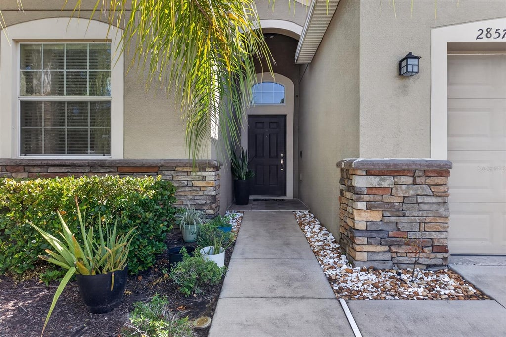 Photo of 2857 Carrickton Circle, Orlando, FL 32824 (MLS # O6445309)