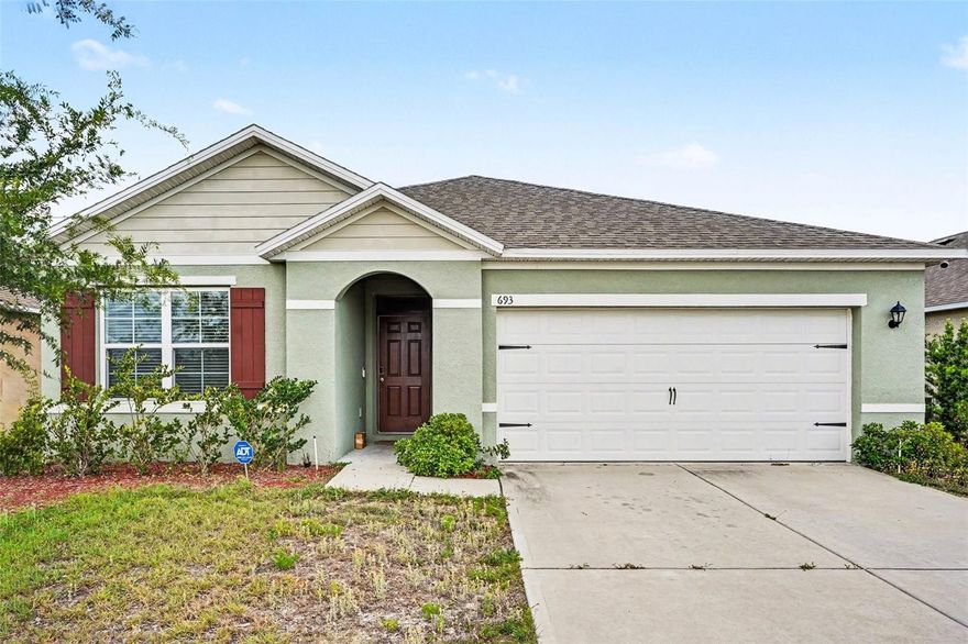 Welcome to this beautifully maintained newer home in the desirable Squires Grove community of Winter Haven! Built in 2022, this spacious 3-bedroom, 2-bath residence offers an open-concept layout with a bright living and dining area—perfect for entertaining. The modern kitchen features ample cabinetry, sleek appliances, and a large island overlooking the main living space. A split-bedroom floor plan provides privacy, with a generous primary suite including a walk-in closet and en-suite bath. Enjoy outdoor living in the private backyard with room to relax or host gatherings. Additional highlights include a 2-car garage, indoor laundry, and energy-efficient construction. Conveniently located near shopping, dining, schools, and major roadways, this home offers comfort, style, and convenience in one of Winter Haven’s growing communities.