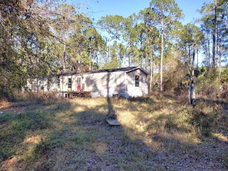 Under contract-accepting backup offers. Handy-man special,  VALUE IS IN LAND AND IMPROVEMENTS. . 3 Bedroom, 2 Bath Single Wide Mobile Home on Secluded 1.1+ Acre Lot with Workshop, Dog Kennels & More! Looking for a property with space, privacy, and endless potential? This 3-bedroom, 2-bath single wide mobile home is the perfect opportunity for handy homeowners, investors, or anyone seeking a rural retreat with room to grow. Situated on a secluded 185x263' lot, this property offers peace and quiet, plus all the extras for country living. open floor plan, split bedroom design, and a large front deck  Out back, you'll find a workshop with electric perfect for hobbies, storage, or projects as well as multiple dog kennels ready for your furry friends. Farm animals are welcome, and there's plenty of room to park your work trucks, trailers, or RV. The property is overgrown, The 
floors are soft so be careful when going through the home.