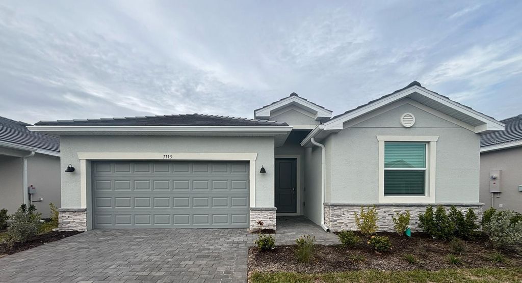 Photo of 7773 Lakes Edge Lane, Port Charlotte, FL 33981 (MLS # C7520418)