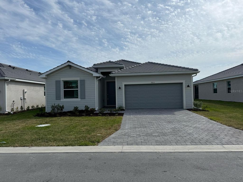Photo of 7773 Lakes Edge Lane, Port Charlotte, FL 33981 (MLS # C7520418)