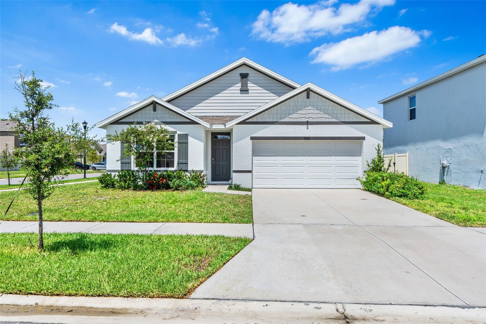 Unpack your bags and move right in! This highly sought-after DR Horton Cali layout—no longer being built in Westgate of Avalon Park West—is a true gem. Offering 4 bedrooms and 2 baths, this beloved and desirable floorplan sits on a spacious corner lot with peaceful front-facing conservation views and beautiful sunsets. Thoughtful upgrades include a fully fenced yard, subway tile backsplash, drop-in sink with a coil spring faucet, custom kitchen island wainscoting, giving this home function and charm. Avalon Park Wesley Chapel is one of the most exciting master-planned communities in Tampa Bay. Enjoy 3 sparkling pools, splash pads, hot tub, clubhouses, dog parks, playgrounds, miles of walking trails, and pickleball courts coming soon—all with lower HOA and CDD fees than most Wesley Chapel communities. Best of all, Avalon Park is built around the vision to Live, Work, Learn, and Play—with a brand-new walkable downtown offering dining, shopping, live music, and festivals just minutes away. This isn’t just a home, it’s your chance to own a highly desirable Cali in one of Wesley Chapel’s most vibrant communities.
