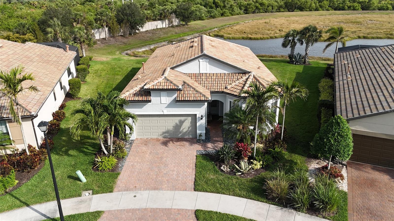 One or more photo(s) has been virtually staged. This impeccably maintained home in the highly sought-after community of Sandhill Preserve offers the feel of brand-new construction with thoughtful upgrades throughout. Set on a premium lot with serene preserve and water views, this residence features three spacious bedrooms, an office space/den, soaring tray ceilings, and upgraded ceramic and wood flooring that adds warmth and sophistication to every room. The exterior of the home was freshly painted, the floors were professionally cleaned.
The office space/den provides a convenient and quiet space for those who prefer to work from the comfort of their home. A stunning, custom floor-to-ceiling glass steam shower brings spa-like luxury into your daily routine. The home also includes a whole-home water filtration system and storm shutters, offering both comfort and peace of mind. One of the rare communities in the area to provide natural gas, Sandhill Preserve also boasts low and very reasonable HOA fees, making this home an exceptional value.
Sandhill Preserve is a gated community of just 305 single-family homes, built by the reputable DiVosta with quality and lifestyle in mind. The grand community center offers a fully equipped fitness center, a conference room, tennis courts, a heated resort-style pool with a spacious lounge area, a fire pit, a barbecue area, a library, and a beautifully appointed space for regular social events and gatherings.
Located just 15 minutes from world-renowned Siesta Key Beach and with convenient access to Venice, Nokomis, and Sarasota’s vibrant downtown, this home truly delivers the best of Florida living.