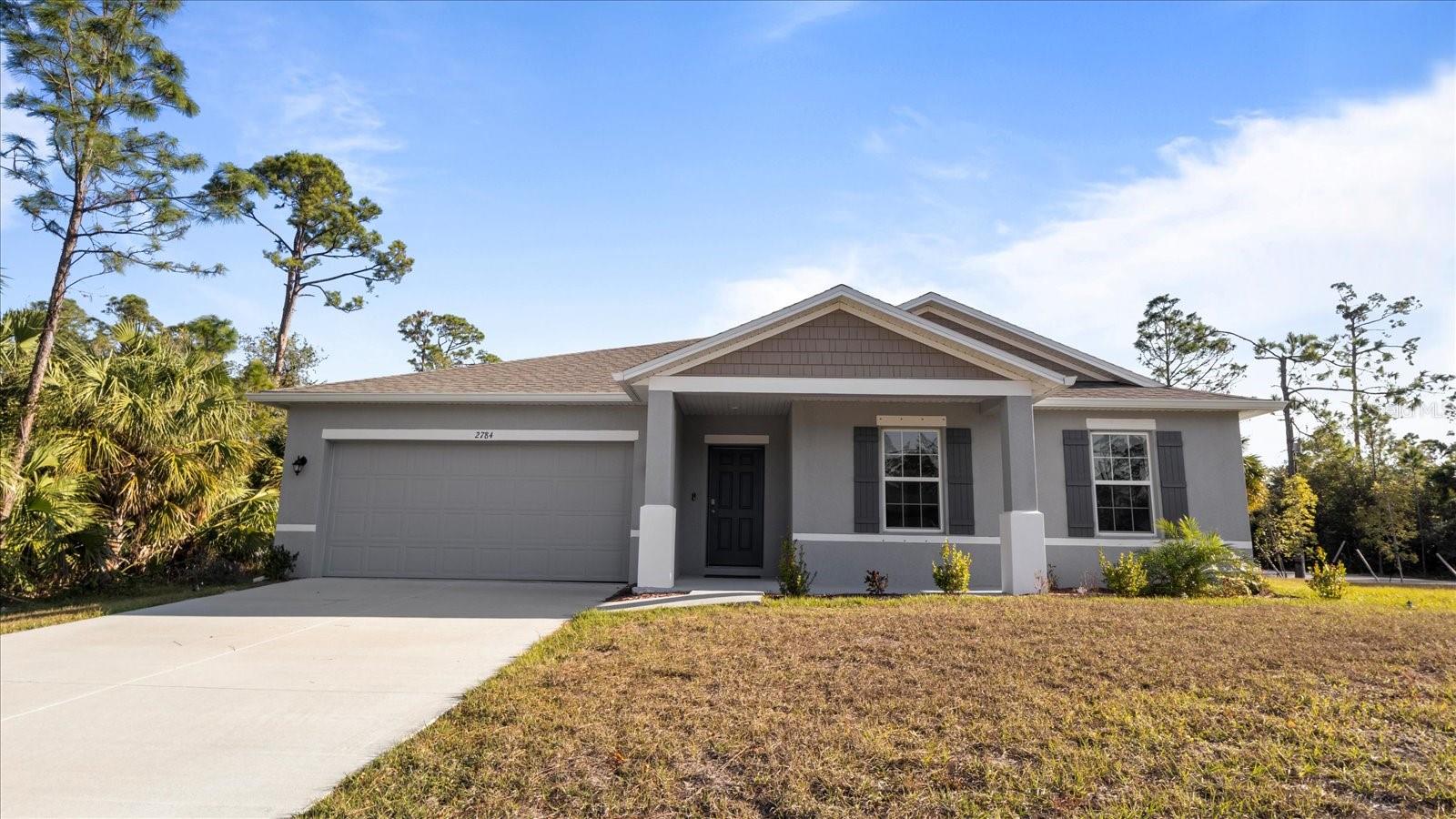 Why wait to build? This brand-new, never-lived-in 4-bedroom, 2-bath home—built in 2023—is move-in ready and packed with upgrades. Nestled on a spacious oversized corner lot with no HOA, no CDD, and no flood zone, this home combines modern style, comfort, and financial freedom.
From the moment you arrive, the home’s charming curb appeal and clean, contemporary lines will catch your eye. Step inside to an open-concept layout filled with natural light and durable tile flooring throughout—no carpet!
The chef-inspired kitchen is the heart of the home, featuring sleek stainless steel appliances, granite countertops, and a large center island that flows seamlessly into the great room—perfect for entertaining or relaxed everyday living.
Retreat to the screened lanai, a peaceful outdoor space ideal for morning coffee or evening gatherings. The epoxy-coated 2-car garage adds both function and flair, and the indoor laundry room comes fully equipped with washer and dryer included.
Whether you're a first-time buyer or looking to upgrade, this home is a rare opportunity to enjoy modern living without the wait. Call today to schedule your private showing.
