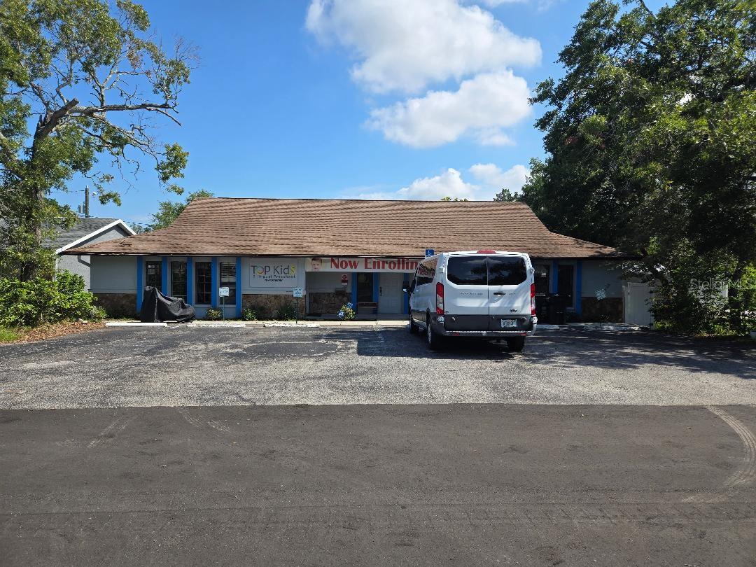 One or more photo(s) has been virtually staged. Established day school within walking distance of downtown New Port Richey. Zoned for office,
single story property is located on very quiet divided street in residential setting. Property
consists of 3 addresses (6115, 6117, and 6119). Well laid out for current use. Real estate only
is being conveyed at asking price shown. Lucrative opportunity for business as well priced at an
additional $200K. Total asking for real estate and business is $925K. Versatile floorplan
measures in excess of 2600 square feet. Parking for 6 vehicles in front of building with
recreational space or additional possible parking in rear.