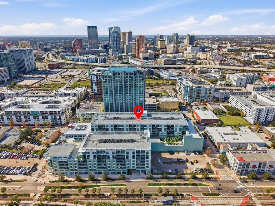 Located at 111 N 12th Street in Tampa’s sought-after Channelside neighborhood, this fully updated 2-bedroom, 2-bath residence offers 1,134 square feet of refined urban living with west-facing views of downtown Tampa. Built in 2007, the secure, amenity-rich building delivers a rare blend of modern design, privacy, and convenience, ideal for those seeking a low-maintenance primary residence or a lock-and-leave second home.

Inside, the home showcases a timeless, minimal aesthetic with luxury vinyl plank flooring throughout the main living areas and tile in both bathrooms. The open-concept kitchen anchors the space with sleek European-style cabinetry, quartz countertops, stainless steel KitchenAid appliances, and a generous island designed for everyday living and entertaining. Modern light fixtures and a built-in speaker system with Bluetooth connectivity elevate the experience, while in-unit laundry adds everyday ease.

The living and dining areas flow seamlessly to a private west-facing balcony, where sunset views stretch across downtown Tampa, Water Street, and the Tampa Cruise Port. The primary suite features a spacious layout, walk-in closet, and a spa-inspired en-suite bath with dual vanities, soaking tub, and walk-in shower. A well-proportioned second bedroom and full bath offer flexibility for guests, a home office, or dual-suite living.

Residents enjoy two dedicated garage parking spaces, a 24/7 staffed lobby, secure access, and onsite management. The building is known for its resort-style amenities, including a heated pool, hot tub, sauna, fitness center, outdoor kitchens and grills, multiple rooftop terraces, community room with catering kitchen, TV lounge, game and card rooms, ping pong and pool tables, and thoughtfully designed outdoor lounging and dining areas.

The Channel District is positioned directly across from the Tampa Cruise Port, Tampa Aquarium, Water Street, Downtown Tampa, Sparkman Wharf, Amalie Arena, The Riverwalk, USF Medical School, and the Crosstown Express Way.  This home places cafes, coffee shops, bars, parks, dog parks, and everyday conveniences right outside your door. This is urban living at its most effortless. Clean, modern, and designed for a lifestyle that values location, security, and style.
HOA Fees Include:  Exterior Maintenance, Exterior Grounds, Manager, Amenities, Escrow Reserves Fund, Common Area Taxes, 
Age of Major Mechanics - Roof - 2024, HVAC - 2021, Water Heater - 2021, Fully Updated Interior - 2021