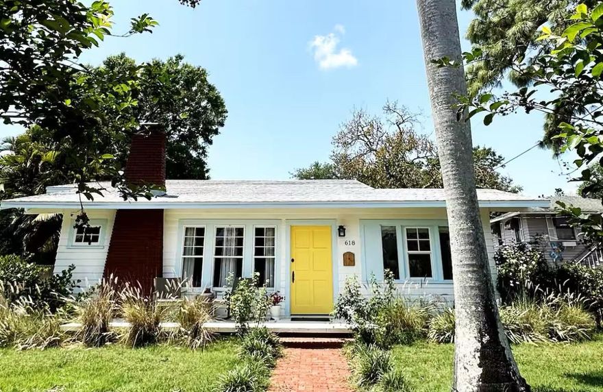 Absolutely stunning 1925 home in Historic Bradenton with Guest House/Efficiency located steps from Downtown, walking distance to shopping, dining, Manatee River & public transportation, and only 15 minutes from gorgeous Gulf beaches, including famous Ana Maria Island! Outstanding location with several lucrative short-term rentals here. Located in an Opportunity Zone for added tax savings and investment potential.     Stroll up the red brick path to the quaint front porch of this lovingly restored and updated home. Upon entering the front door, you'll immediately notice the restored wood plank flooring in the large great room with cozy fireplace and loads of natural light! The ceilings were raised adding to the roomy feel of this open, well-thought out floorplan.  To your right, the third bedroom features French doors and looks out over the front of the home, making a great work-from-home-office. Beyond the great room is the formal dining room and beyond that, the renovated white kitchen with solid wood cabinets, 2019 SS appliances, including 5 burner gas stove and spotless butcher block counters. Beyond the kitchen, is the laundry room, complete with washer & dryer that doubles as a mud room and leads to the back door.     The hall bathroom features a gorgeous claw-foot tub with shower head and linen closet. The bedrooms are designed in a 3-way split with the office/bedroom in the front, the second bedroom in the middle of the home, off of the dining room and the primary bedroom in the back of the house. The primary bedroom boasts an en suite bathroom with stand-up shower and two walk in closets. Walk in closet in the second bedroom, as well.     Detached garage in back has been converted to an efficiency with kitchenette, full bathroom with stand-up shower and walk-in closet, adding an additional sq ft of living space So many great possibilities for this space - in-law suite, young adult apartment, potential income-producing. However, there is still a garage door and opener, so you could convert back if that's your preference.     Adjacent driveway has plenty of room to park two large vehicles, a bit more space toward the alley to park one more, and the other side of the garage has ample room for boat or RV parking. The side yard is fully fenced for your furry friends, and the deck is roomy enough for grilling, lounging and entertaining.     Recent upgrades include newer kitchen and bathrooms, restored windows, updated plumbing & electric, updated electrical panel, new roof, A/C and ductwork (2018), sprinkler system (2021), new driveway (2021), guest house remodel (2020).
