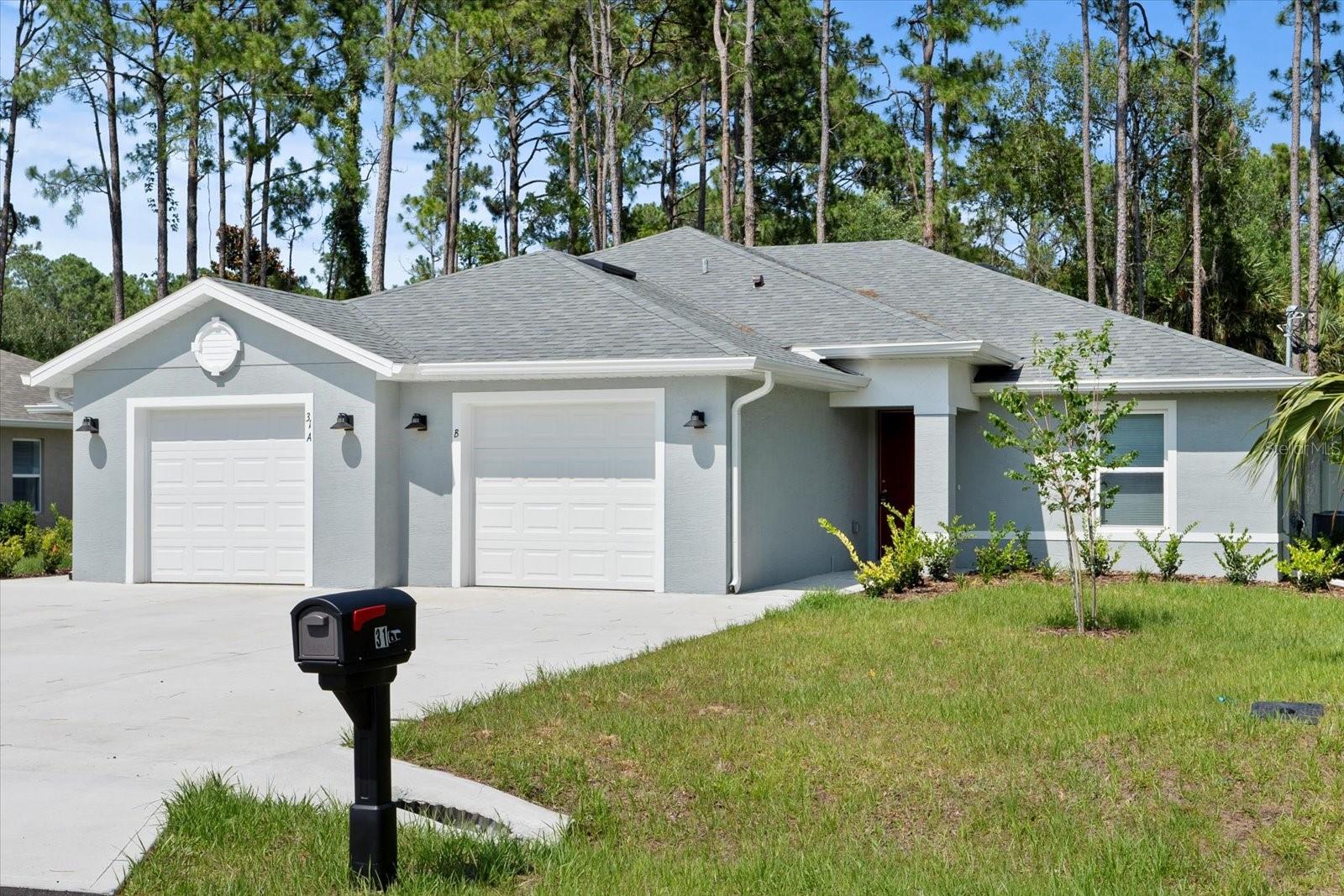 Exceptional investment opportunity in the prime Seminole Woods location! Seize the chance to own this newly constructed 2024 Seagate duplex, a perfect gem for investors. This isn't your typical duplex—it's a high-quality build designed to impress both tenants and owner-occupants alike. Whether you're looking to rent out both units or live in one while leasing the other, this property offers unparalleled versatility and value. Experience single-family home luxury with top-tier builder upgrades, tile flooring throughout both units, stunning quartz countertops, and a sleek stainless steel appliance package. The open-concept living and dining areas boast high ceilings, elegant chandeliers, and ceiling fans, creating a bright and inviting space. Each primary bedroom suite features a walk-in closet with ample storage space. Step through the kitchen’s sliding glass doors to a private, fully fenced backyard with covered rear porches—perfect for relaxing and entertaining. Enjoy the convenience of being close to Flagler Beach, Target, Aldi, Starbucks, banks, pharmacies, dining, and more. Ideally located between Ormond/Daytona Beach and St. Augustine, making commutes and city explorations easy and convenient. Invest in a property that combines quality, comfort, and a prime location. This duplex is not only a superb investment but also a desirable residence. Don't miss out—schedule a tour today and discover all the benefits this property has to offer! For more details or to arrange a viewing, call now! #29 is also available for purchase next door.
