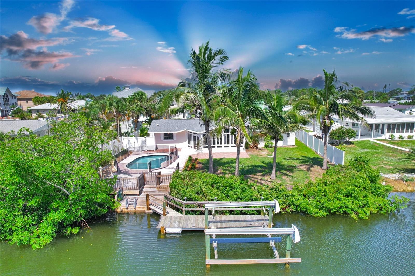 One or more photo(s) has been virtually staged. YOUR DREAM HOME JUST HIT THE MARKET!***WHAT AN OUTSTANDING LOCATION! *** DON’T MISS OUT! WATER FRONT! SALTWATER CANAL ACCESS, POOL AND BOAT LIFT! VERY PRIVATE & PEACEFUL! Just minutes away from the GULF, jetty & drum circle, Pop's Sunset Grill or Pelican Alley. This stunning and very welcoming FULLY RENOVATED home features 2146 sq/ft, 3 BEDROOMS WITH CUSTOM BUILT WALK-IN-CLOSETS / 2 NEWLY REMODELED BATHROOMS / NEWLY INSTALLED, ELEGANT KITCHEN WITH STYLISH BACKSPLASH, SOFT CLOSING CABINET DOORS AND DRAWERS, PLUS BRAND NEW APPLIENCES/ BEAUTIFUL AND SPACIOUS FAMILY ROOM WITH VAULTED, FEATURED CEILING / LIVING ROOM WITH DINING AREA/ LARGE LAUNDRY ROOM with OFFICE SPACE/ PRIVATE POOL OVERLOOKING THE CANAL/ SHED FOR EXTRA STORAGE/ BOAT DOCK WITH WATER SUPPLY, LIFT and much more. Just less than a mile to the world-famous Nokomis Beach on the Casey Key and it is truly a jewel where you can even get faster kayaking or boating. Minutes to Lyons Bay, Intracoastal Waterway and Venice North and South Jetty. DREAM HOME IN DREAM LOCATION! YOUR OWN SLICE OF PARADISE AWAITS! This prime location offers not only being minutes away from beautiful beaches but also in close proximity to wide selection of dining options, shopping plazas, public golf courses, medical facilities, jetty, fishing spots, and so much more plus it’s located near Sarasota and Fort Myers airports.
THIS IS TRULY A MOVE-IN READY CANAL HOME which will impress you from the second you enter. LONG canal views from the family room and gourmet kitchen.
***NO HOA or CDD Restrictions*** NEW ROOF 2022, A/C 2020, WATER HEATER 2021, BRAND NEW ELECTRICAL PANEL 2025, FRESHLY RE-PAINTED INSIDE AND OUTSIDE. SUNROOM/FAMILY ROOM FACING THE CANAL HAS ALL HURRICANE PROOF WINDOWS AND DOORS. BOAT LIFT 8000 LBS. HOUSE WAS RE-PLUMBED/RE-PIPED IN 2007 AND HOOKED UP TO CITY WATER. NO STEPS JUST FLOWING FLOOR PLAN AND VERY ACCESSIBLE IN AND OUT SUITABLE FOR ALL AGES. NO CARPETS, TILES THROUGHOUT.
Bring your boat, kayaks, canoes, paddle boards and bikes and live your dream life! The FLORIDA GULF LIVING AWAITS YOU! A MUST SEE for any boating enthusiast or water lover.
You deserve it! Start your day by watching the sunrise from your Family room, pool or dock. Bike to the beach, kayak to the nearby restaurant, boat in the evening to watch the sunset or watch dolphins and manatees from your very own dock or while on the water. Opportunities are endless with this beautiful home, one of the kind and not often available! YOU JUST FOUND YOUR NEW HOME! Don’t miss out!
Please check our virtual tour!
Call to schedule to see this home today!