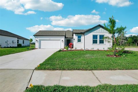 Photo of 10045 Hidden Hammock Loop, Parrish, FL 34219 (MLS # TB8473875)