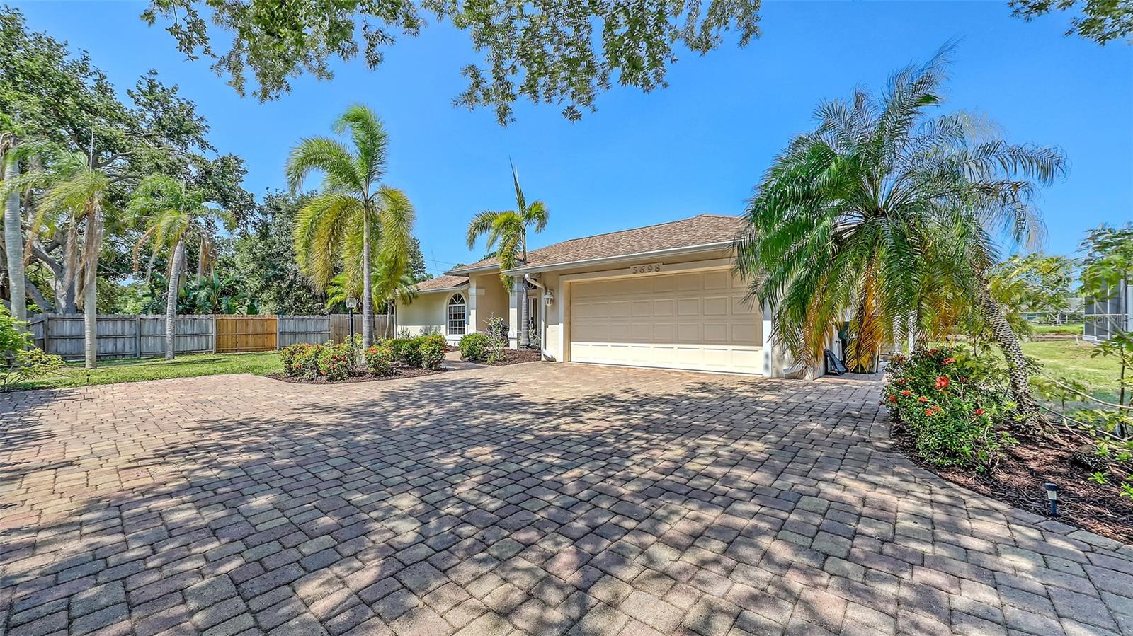Welcome to your own personal haven at 5698 Country Walk Lane, an immaculate 4-bedroom lakefront residence in Sarasota's reputable school district, boasting unmatched charm and contemporary elegance. This meticulously maintained home boasts opulent finishes, featuring luxurious porcelain tile flooring, refreshed interior and exterior paint, a newer roof, water heater, and a modern HVAC system enhanced with UV purification—perfectly designed for both comfort and convenience.
Step into the inviting open floor plan where full-length sliding glass doors seamlessly blend indoor luxury with outdoor tranquility, opening onto a generously-sized screened lanai that overlooks expansive views of a serene lake. Imagine creating your custom outdoor paradise here, with ample room for an elegant pool and spa, turning your backyard into a private retreat.
The gourmet kitchen is a culinary dream, highlighted by stunning quartz countertops, sleek cabinetry, and abundant workspace, perfectly suited for hosting elegant gatherings or intimate family dinners. Retreat to your exclusive Master Suite, featuring beautiful wood-look tile flooring, a spacious walk-in closet, dual vanities, a relaxing garden tub, and a Roman-style shower.
Positioned on a coveted oversized corner lot at the end of a quiet, private street, this property ensures maximum tranquility and privacy. With its premium paver driveway and beautifully landscaped gardens, the curb appeal is undeniable. Located just moments from Downtown Sarasota, pristine Siesta Key beaches, vibrant arts scenes, upscale shopping, and gourmet dining, this home provides an unparalleled lifestyle.
Make 5698 Country Walk Lane your sanctuary—where luxury meets serenity, and your dream outdoor oasis awaits.