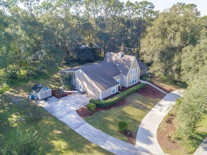 Spectacular 6 bedroom 3.5 bath pool home offering over 4,400 square ft of living space in Country Club. NO HOA! You will be impressed from the moment you drive up to this beautiful property situated on almost an acre of land among mature trees and circular driveway. Room for the family Boat, RV and all the toys! Recent upgrades include a NEW AC, Flooring, Roof, Pool Deck, & Pool Pump. The interior is just as fabulous offering vaulted ceilings with plenty of windows bringing in tons of natural light. Each room is bigger and better than the next. Kitchen has been fully updated with custom white cabinetry and granite countertops. There are TWO Master Bedroom Suites each with their own bath downstairs. FOUR Additional Bedrooms, Full Bath & Bonus Room upstairs. So many entertaining options from the elegant Formal Dining & Living Rooms to the HUGE Family/Game Room equipped with built in counters, sink, & refrigerator. The Family room does not disappoint w/ soaring ceilings, beautiful wood beams, & a dramatic floor to ceiling brick fireplace perfect for cooler winter evenings. French Doors lead out to the peaceful screened pool deck. Home is also equipped with TWO tankless water heaters. Everything you could possibly want in your forever home. Truly a one of a kind and perfect for large or multi generational families. Located 30 minutes to downtown Orlando or 30 minutes to the Atlantic Oceans white sandy beaches! Call for your private showing today!