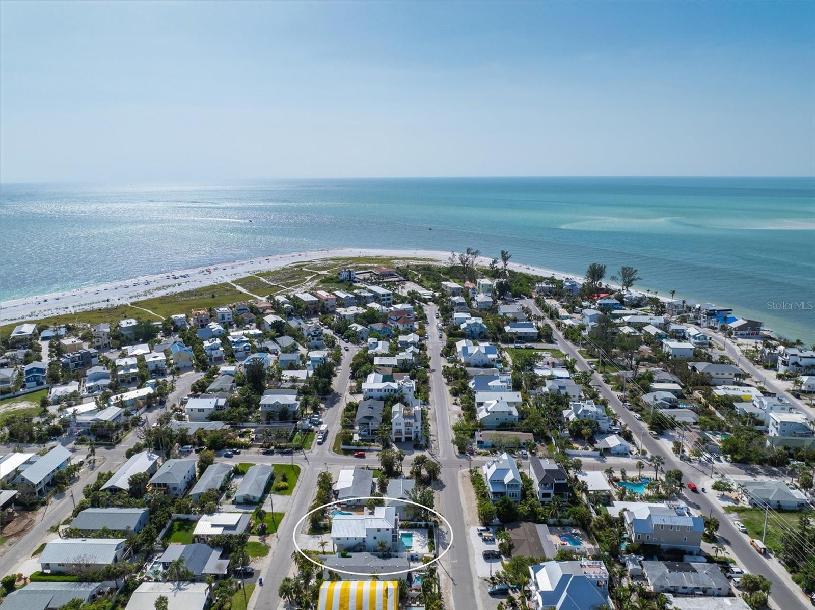 THIS is PARADISE! Enjoy this like-new construction beautiful 3 bedroom, 3 bathroom multi-leveled home. Nestled on the north end of Anna Maria Island just steps away from the sparkling waters of the Gulf and Bay as well as close to Pine Ave! Enjoy the natural sunlight open concept and the professionally decorated interior design. You will absolutely love the open floor plan on the main living level and deck that overlooks the pool/spa and tropical backyard. The kitchen is decked out with top notch Quartz waterfall counter-tops and a large kitchen island with a hidden walk-in butlers pantry. 3 bedrooms perfectly spaced out for added privacy all with updated modern bathrooms. Your primary bedroom features a double sided luxury step-in shower with rainfall shower heads in the ensuite bathroom with dual sinks and ample counter space and a standalone bathtub. Enjoy the lush backyard and the coolness of your private heated pool and covered outdoor kitchen area! Relax in the tropical oasis of a beautiful backyard. Would be a great investment property and can be rented 1-7 days, never a vacation rental, so it has no wear and tear from a busy rental! Schedule your showing today! **Roof 2025, Pool + Equipment 2024, house comes with a 10 year Termite warranty.**